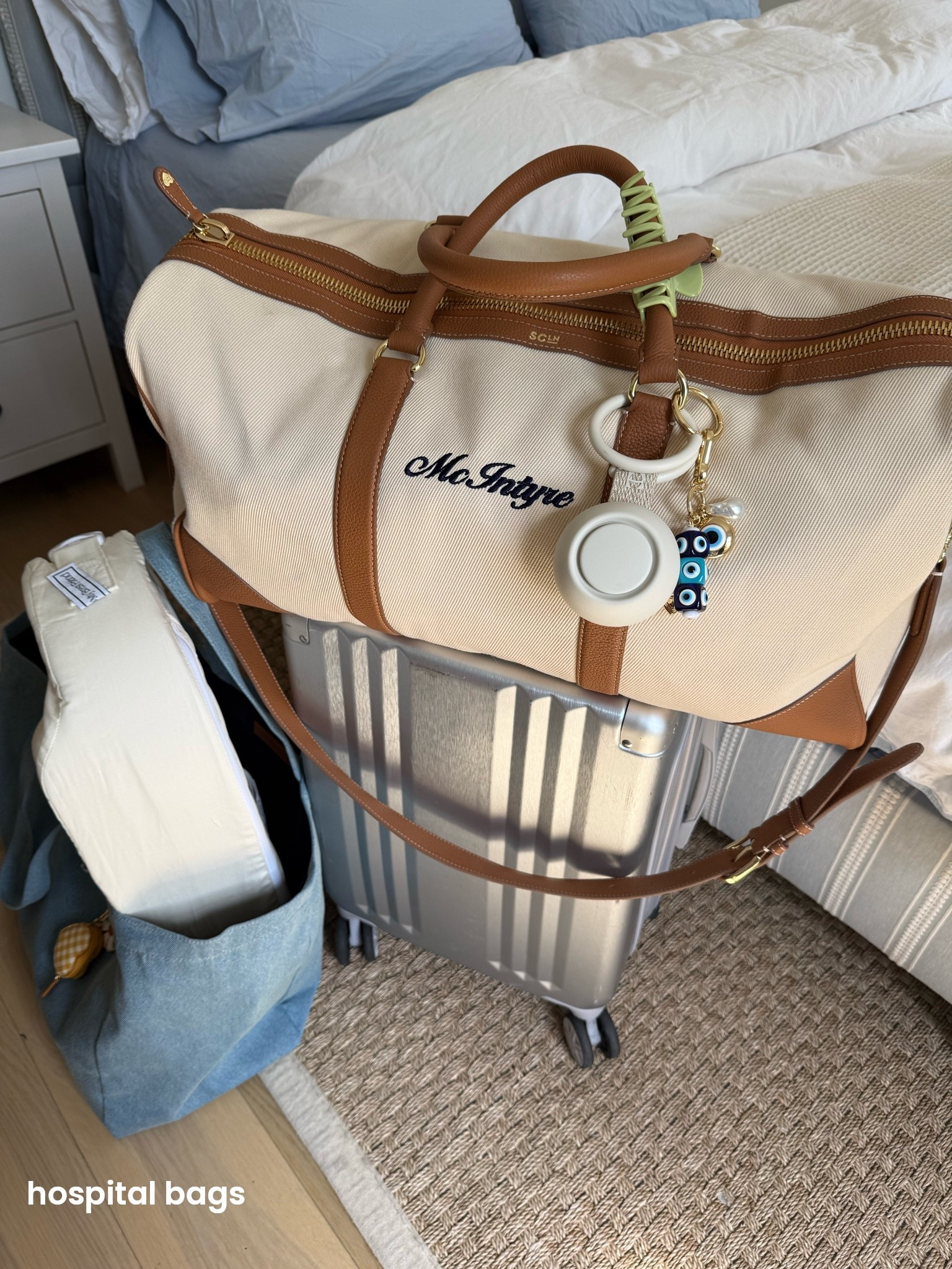 hospital bags packed and ready 🤍 duffle bag linked from Stoney Clover, and baby sound machine from Hatch and charms from BaubleBar 🧿 blue denim tote is also Stoney Clover with mini heart bag pouch. Carryon is @CALPAK and on of my most used suitcases

#LTKBump #LTKmomlife #LTKBaby