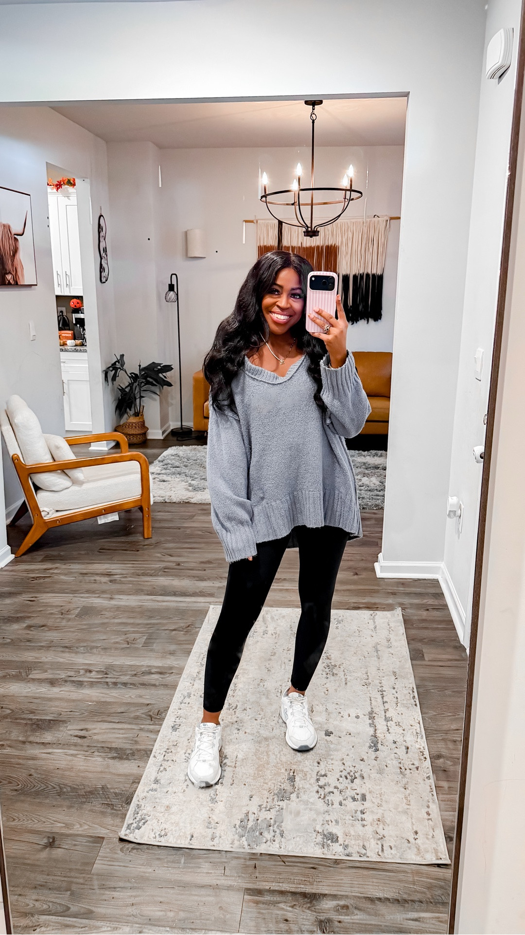 I am 5’4” wearing a size small in the sweater and leggings. I went with my normal size in the sneakers.