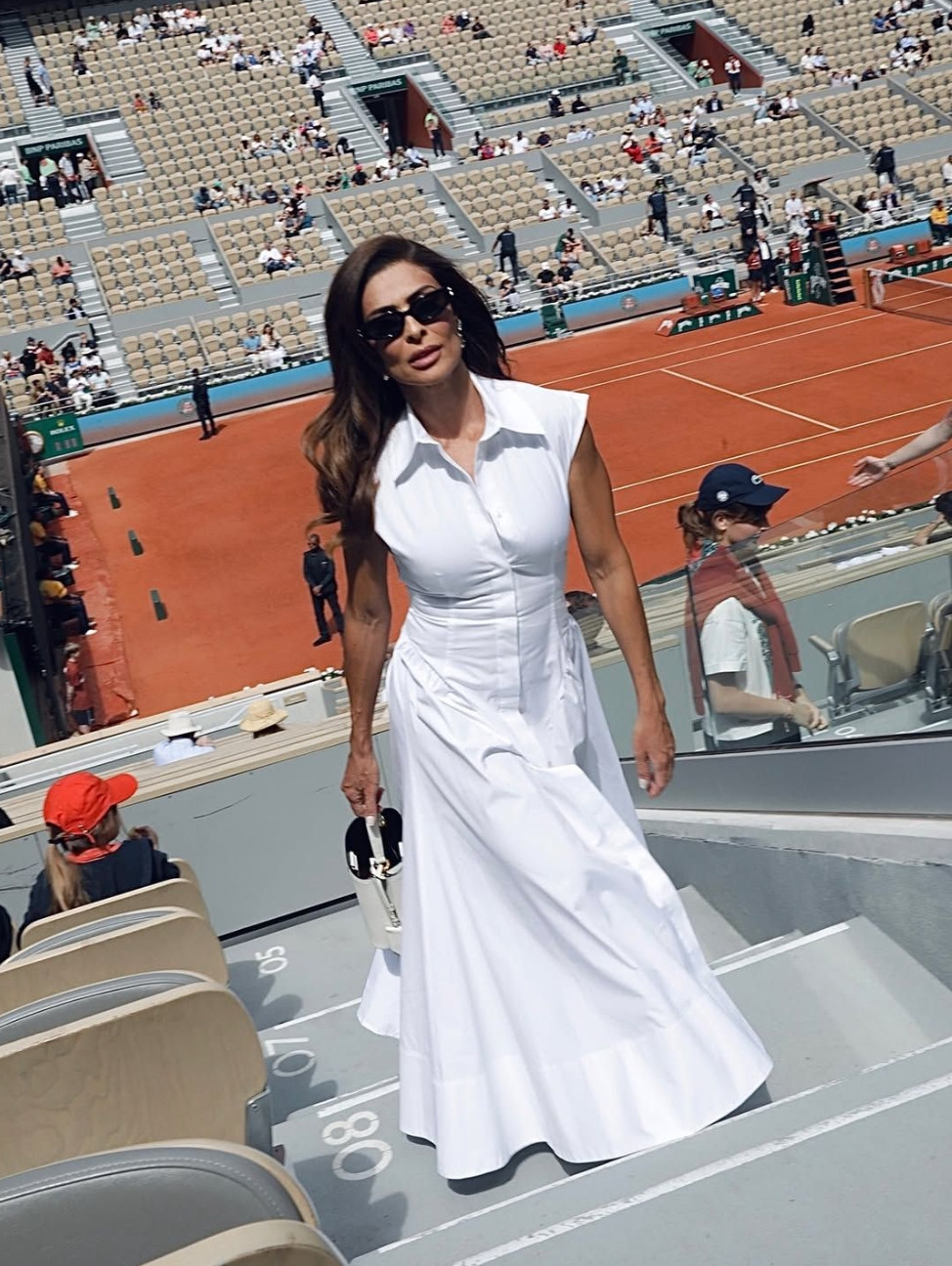 Chic white dress outfit featuring a sleeveless midi dress and minimal accessories—perfect for elevated summer style and timeless outfit ideas.
Style tip: opt for classic silhouettes and neutral tones to create a versatile wardrobe, and keep your look refined with simple, structured accessories for an effortlessly polished finish. 

 #LTKootd