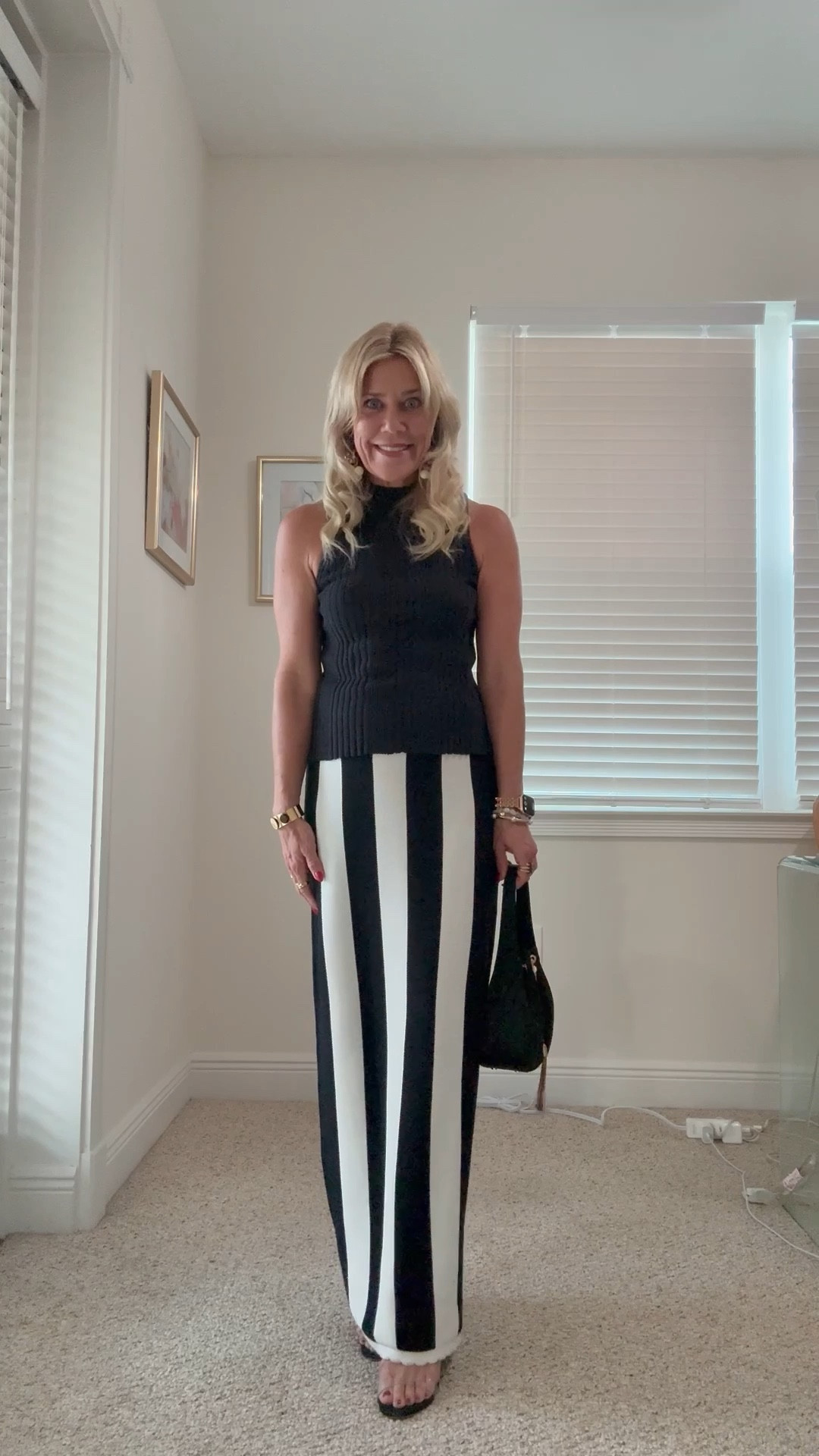Transition to fall black & white outfit. Sleeveless knit top paired with this vertical stripe black and white knit skirt by Anthropologie. Handbag is Olga Berg, jewelry has a fall twist and is from a Parisian jewelry store, except for the earrings by Tuckernuck. 🖤🤍🖤

#LTKPetite #LTKOver40 #LTKItBag