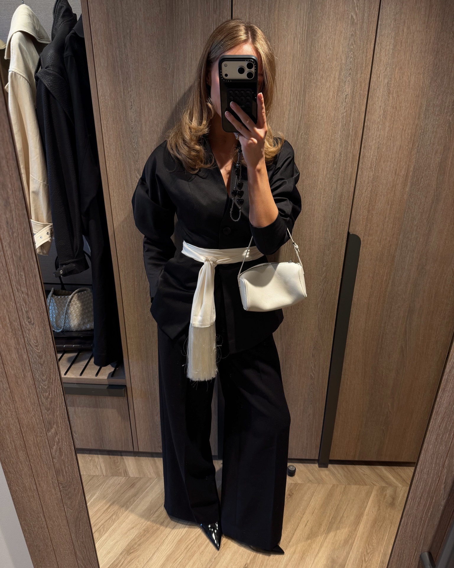 Black tailored trouseres, collarless blazer, cream fringe scarf, white bag, the row 90s bag amazon, black patent heels

#LTKuk #LTKspring #LTKdatenight