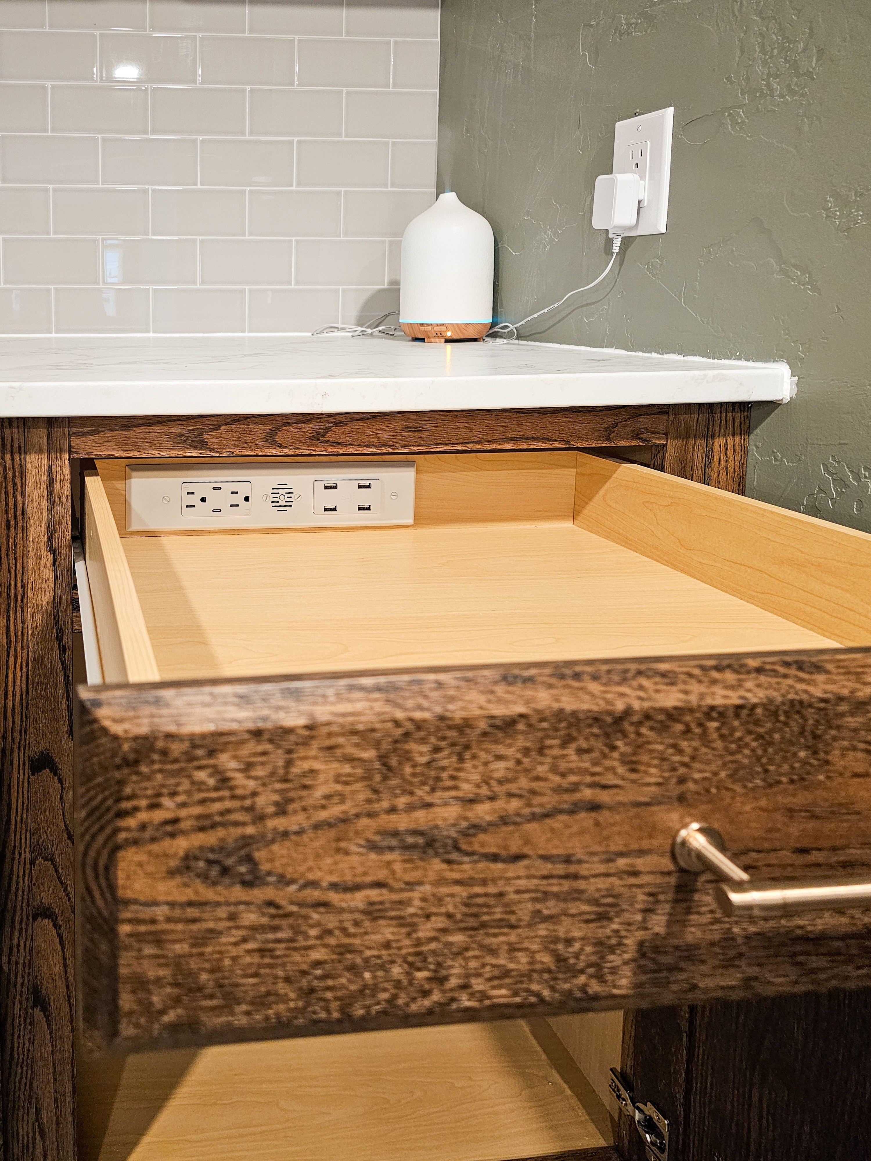 This docking drawer outlet has completely cleaned up our charging situation, keeping cords and chargers tucked inside the drawer instead of cluttering the counter. It's such a simple upgrade that makes a huge difference in how organized the space feels. #chargingstation #kitchenorganization 

 #LTKHome