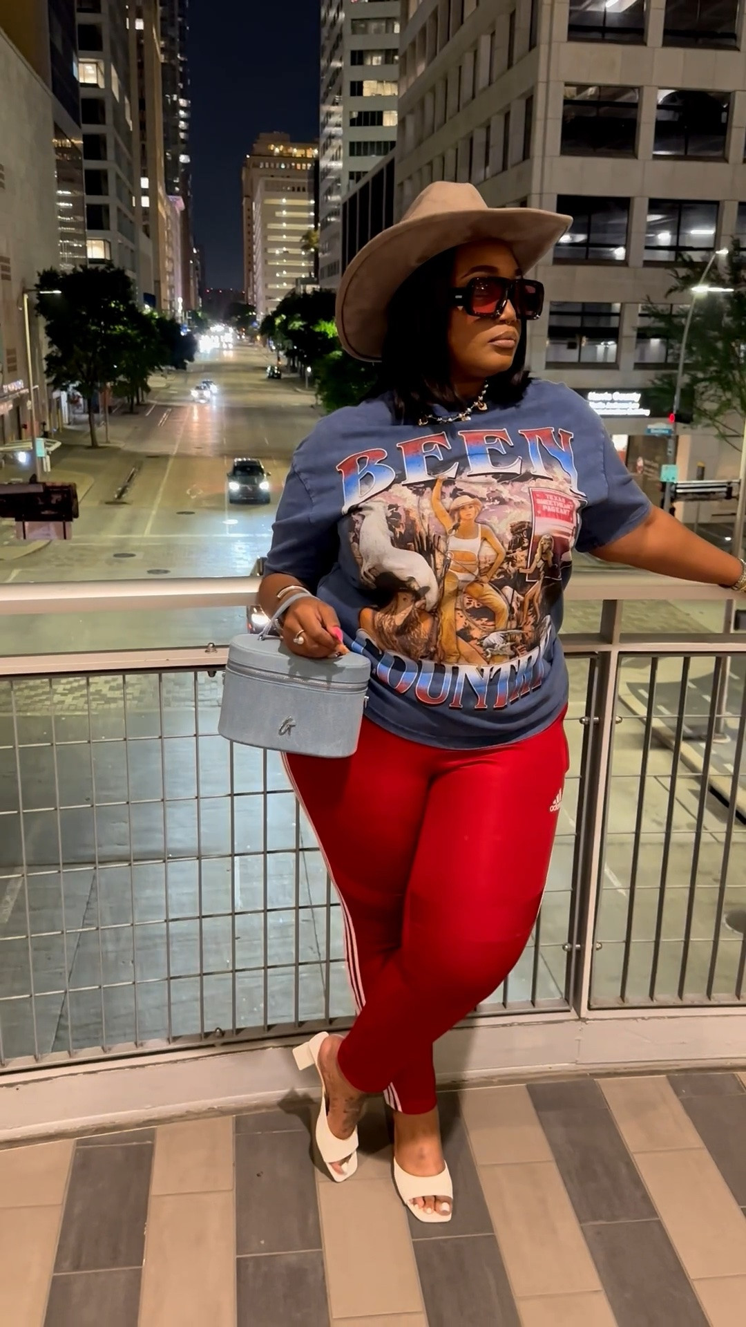 Plus size outfit idea for the girls who love a casual outfit that still makes a statement. 

Lately I’ve been realizing that accessories are what really make an outfit feel styled.

A statement tee, Adidas pants, a cowboy hat, oversized sunnies, layered jewelry, and a good bag can completely change the vibe of even the simplest outfit.

This is the kind of look I’d wear for a concert, casual date night, brunch, running around the city, or anytime I want to feel cute and comfortable at the same time.

And this denim vanity bag? SUCH a good affordable luxury find. It gives designer-inspired energy without the luxury price tag and instantly makes casual outfits feel more elevated and put together.

The kind of bag that gets compliments every single time I wear it.

Linking my bag, accessories, and everyday jewelry because these are the pieces I keep wearing on repeat lately.

#LTKPlusSize #LTKootd