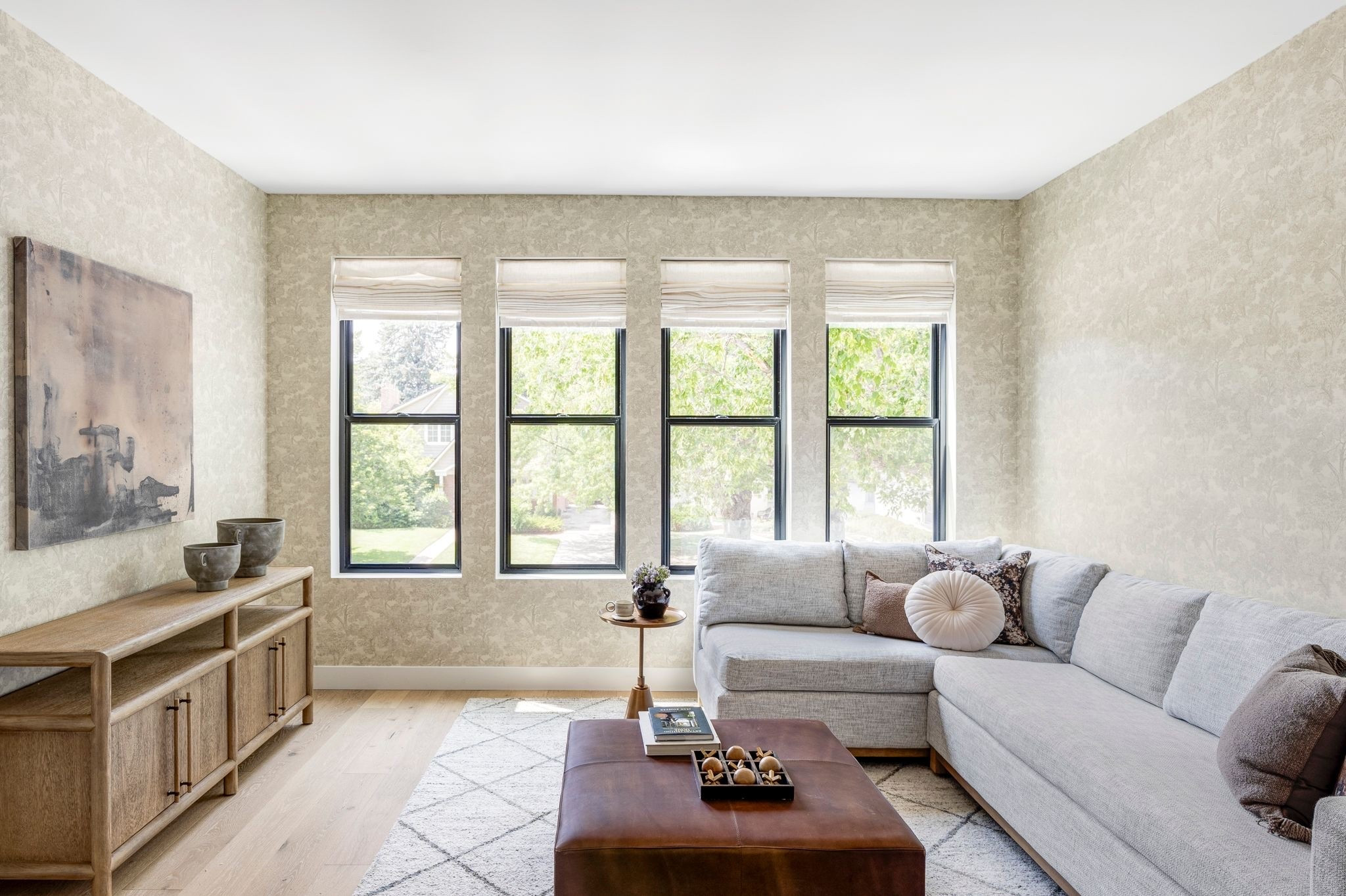 Cutest loft with leather ottoman, sectional, pattern rug and console

#LTKHome