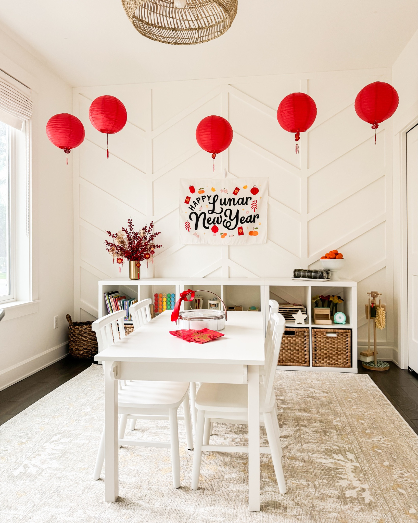 Lunar New Year Decor with paper red lanterns, hanging pendants, brass vase, Chinese new year decorations, craft table, wooden chairs, rug! 


#LTKHome #LTKKids #LTKSeasonal