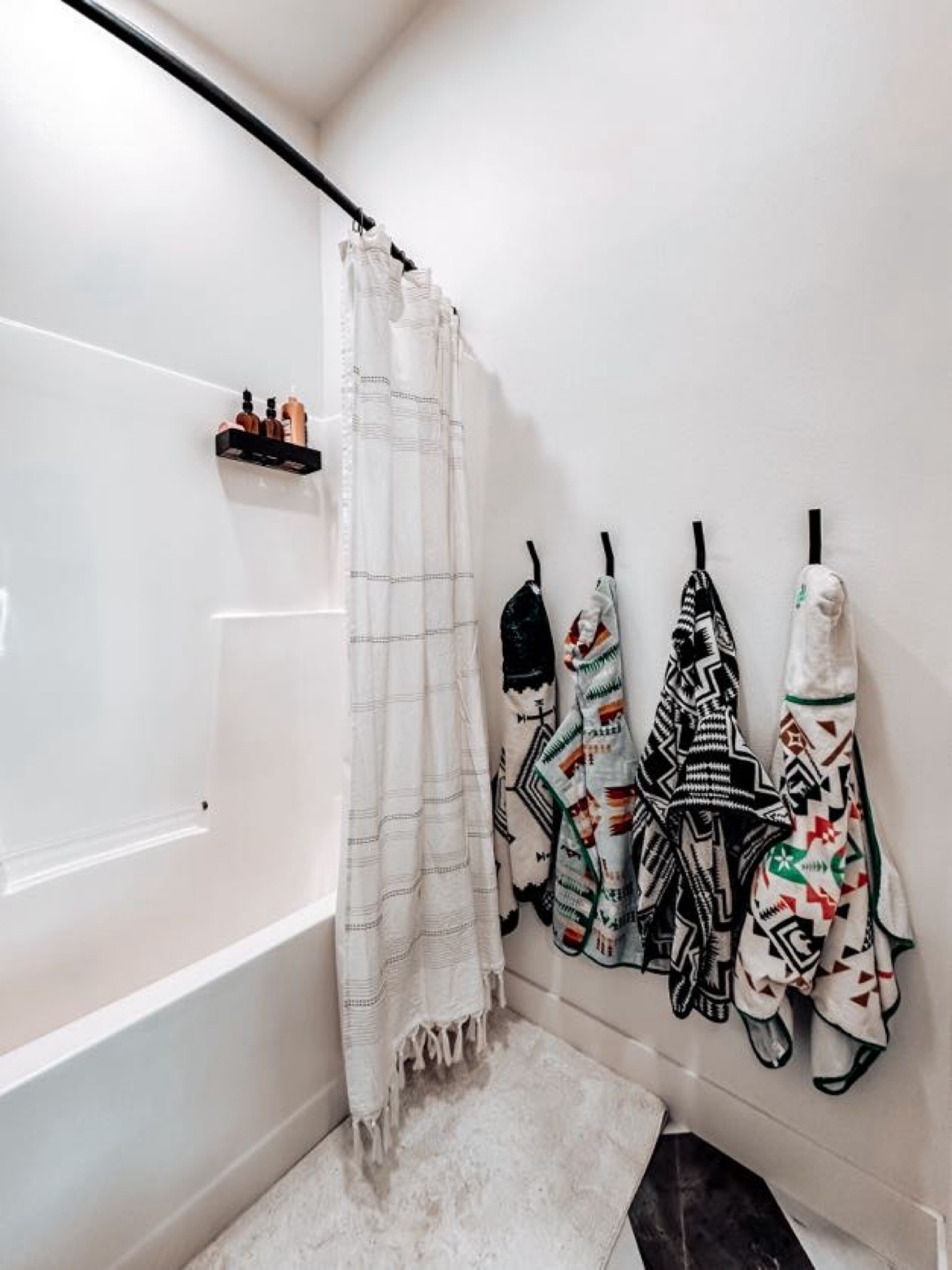 The curved shower curtain rod and shower wall baskets are game changers! The hooks make it much easier to hang six towels. A full-length rug by the tub has been highly functional for kids and splashes. We installed the floor ourselves—it’s very doable. The paint color is Benjamin Moore White Dove, which is warmer and creamier than the floor, but it works well for now.

Amazon home finds // Amazon bathroom // western kids towels // diy floors // bathroom inspiration // home decor inspiration // Western style home 


#LTKFamily #LTKHome #LTKActive