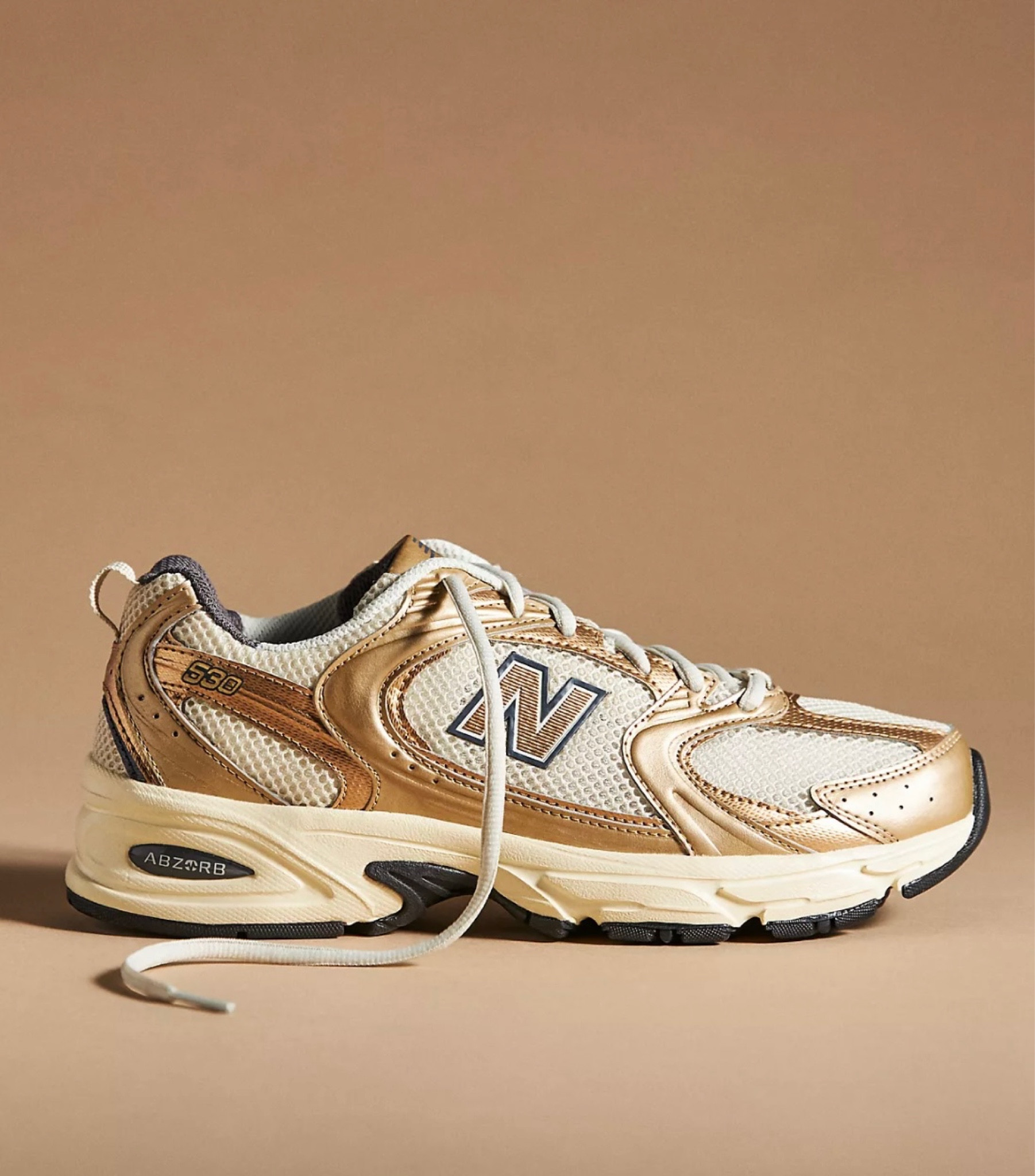 Metallic new balance 
#anthropologie 

#LTKshoecrush #LTKSeasonal