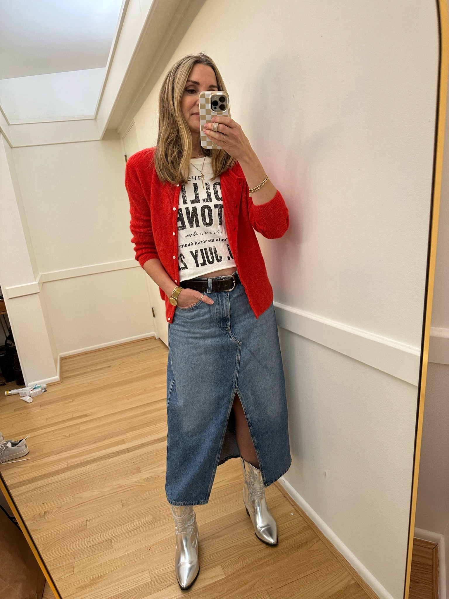 Sunday winter outfit: Sezane red cardigan, Rolling Stones graphic tee, mango denim skirt, and silver western boots

#LTKsalealert #LTKstyletip #LTKfindsunder50