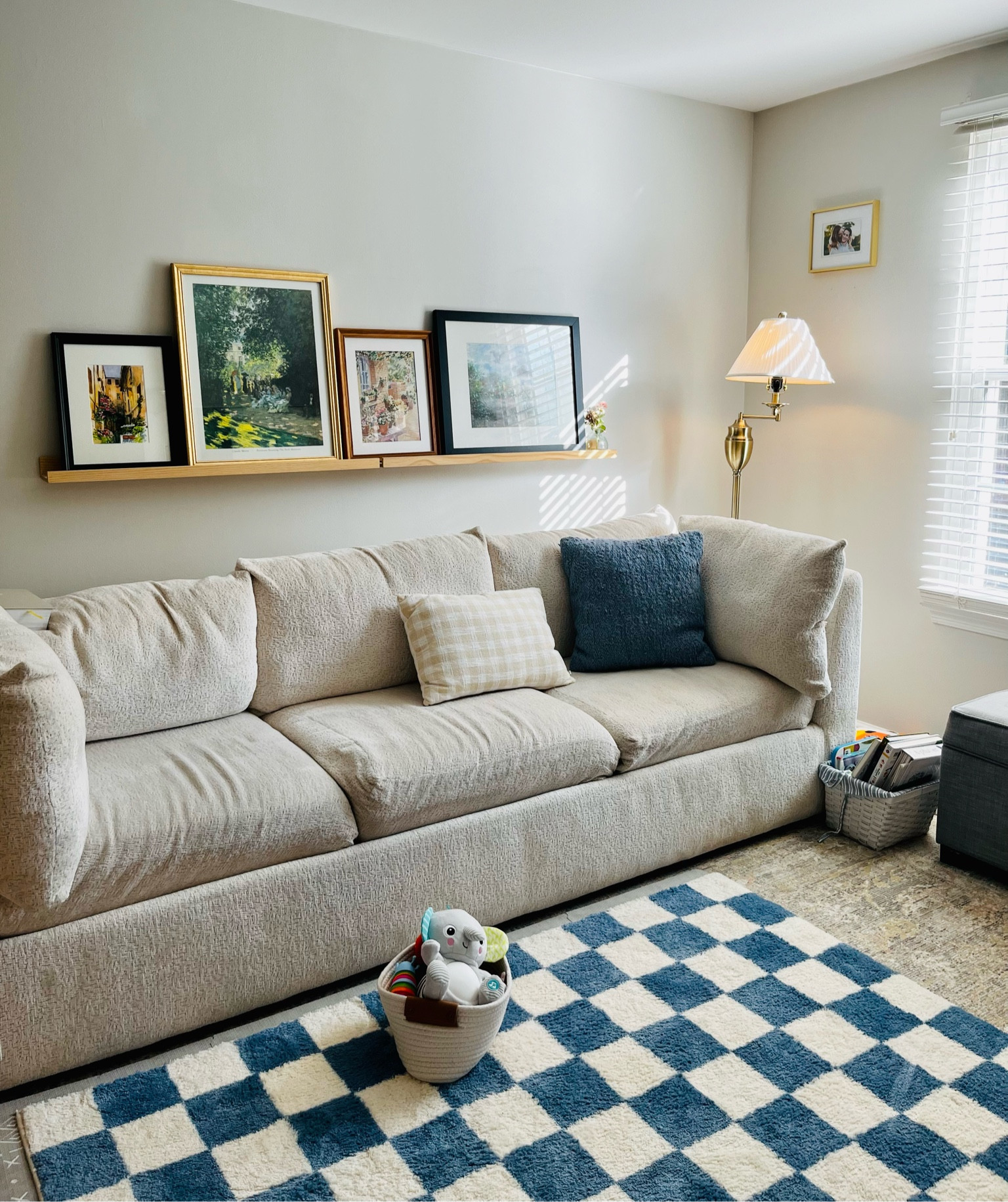 The cutest little baby-friendly living room 🫶🏼

We have a rug layered with an Amazon play mat and another little blue checkered rug on top of that. Most of the art and frames were thrifted but I linked similar ones. The lamp is from target (though the one I linked is more expensive than when I bought!) and the shade was thrifted too. 

#LTKfamily #LTKhome #LTKbaby