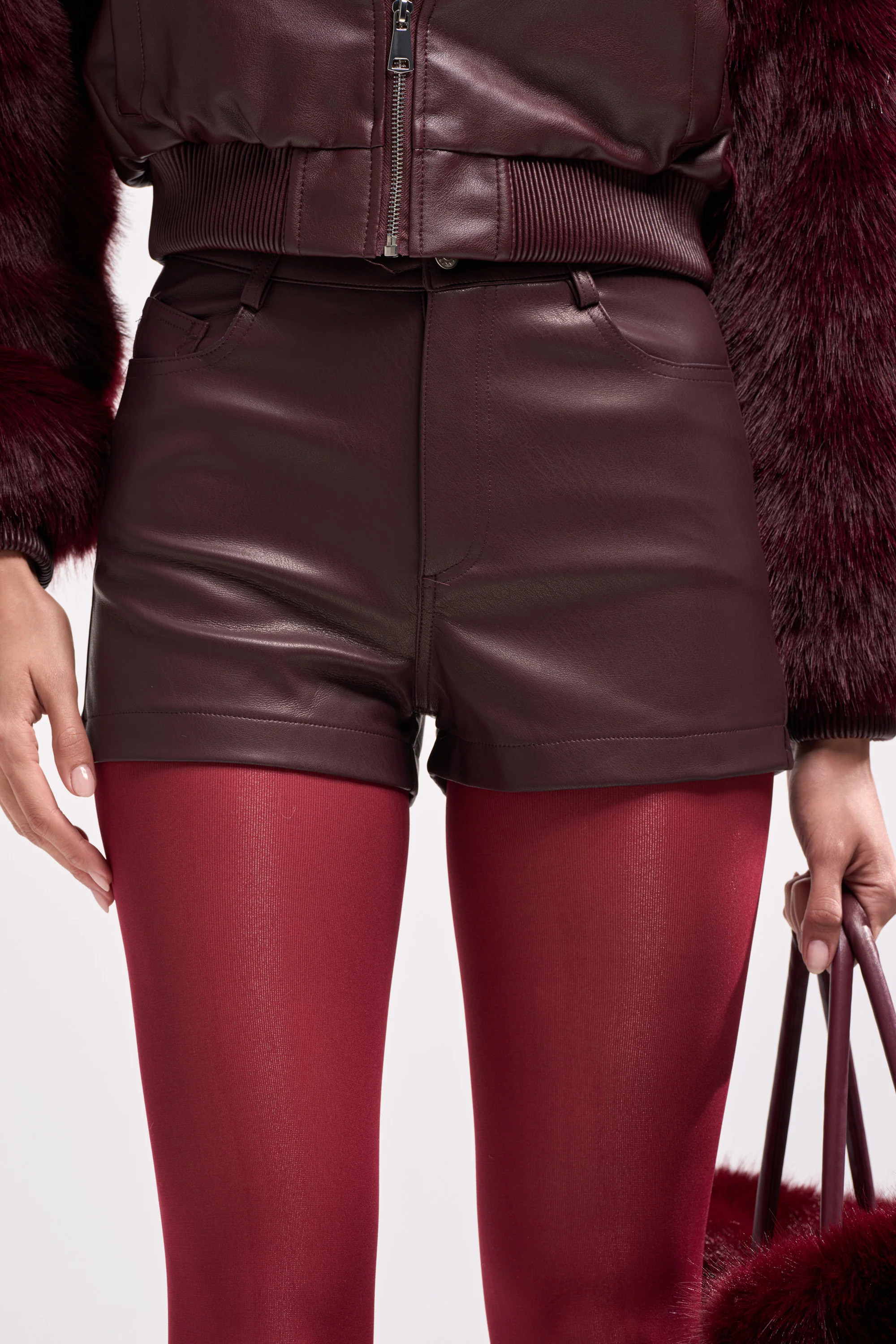 CALLIE FAUX LEATHER SHORT IN BURGUNDY | AKIRA
