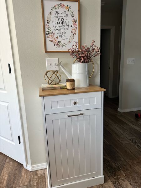 Fall decor! Amazon home. Faux flowers filled in a white pitcher. Gold orb is Walmart home decor. Sign is hobby lobby. Fall candles. Entry way styling. Entry table. Kitchen decor. 

Love this cabinet to hide your trash can! Provides more space if you have a small kitchen or you could also use as laundry hamper. 

#LTKhome #LTKSeasonal #LTKunder50