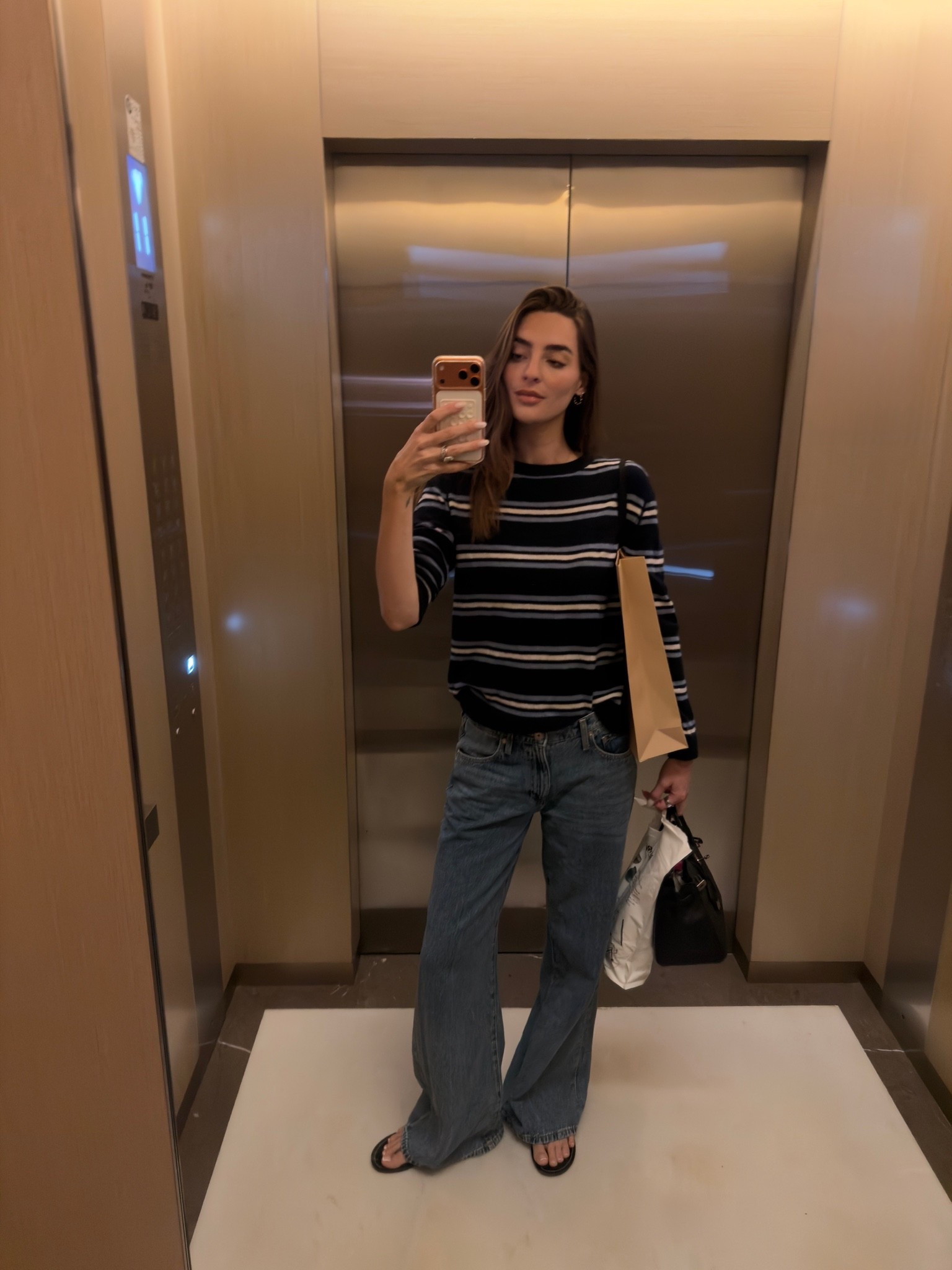 Casual comfy style, reformation sweater, Zara low rise denim jeans, Christopher esber flip flops