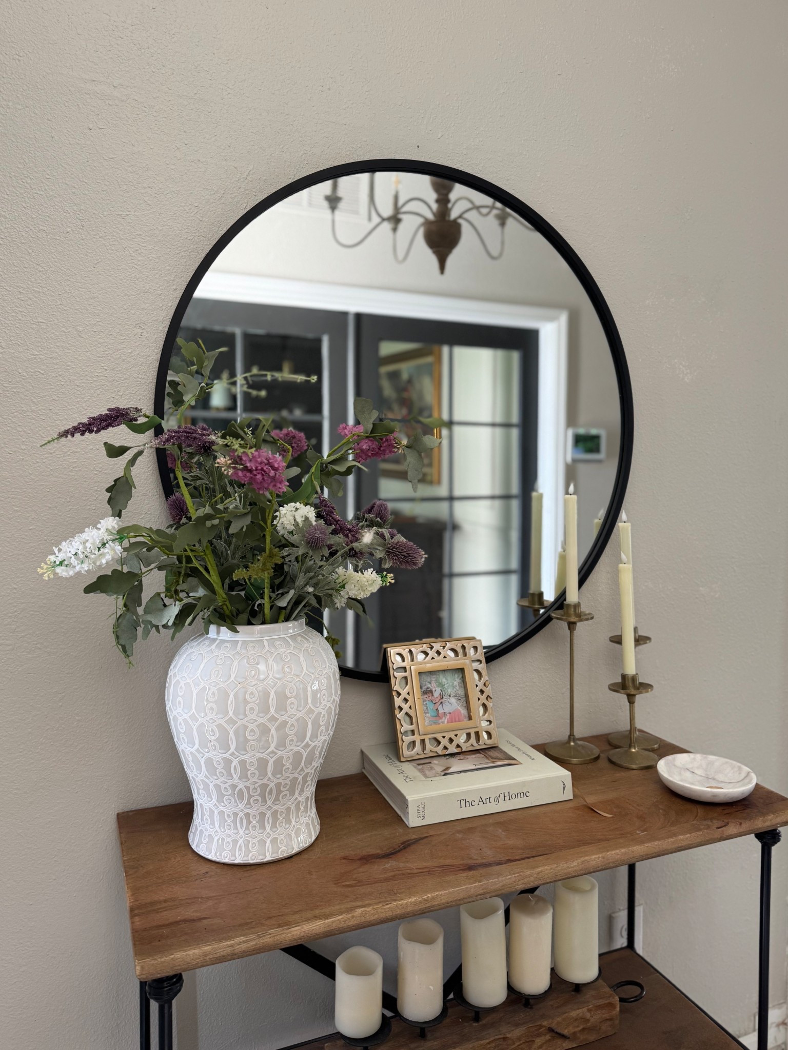 Love this 36” round mirror—it adds the perfect soft, modern touch to the entryway. I removed the faux shiplap to create a more seamless flow with the board and batten on the stairs, and it instantly opened up the space. I may add molding later for a more finished look 🤍

#LTKHome