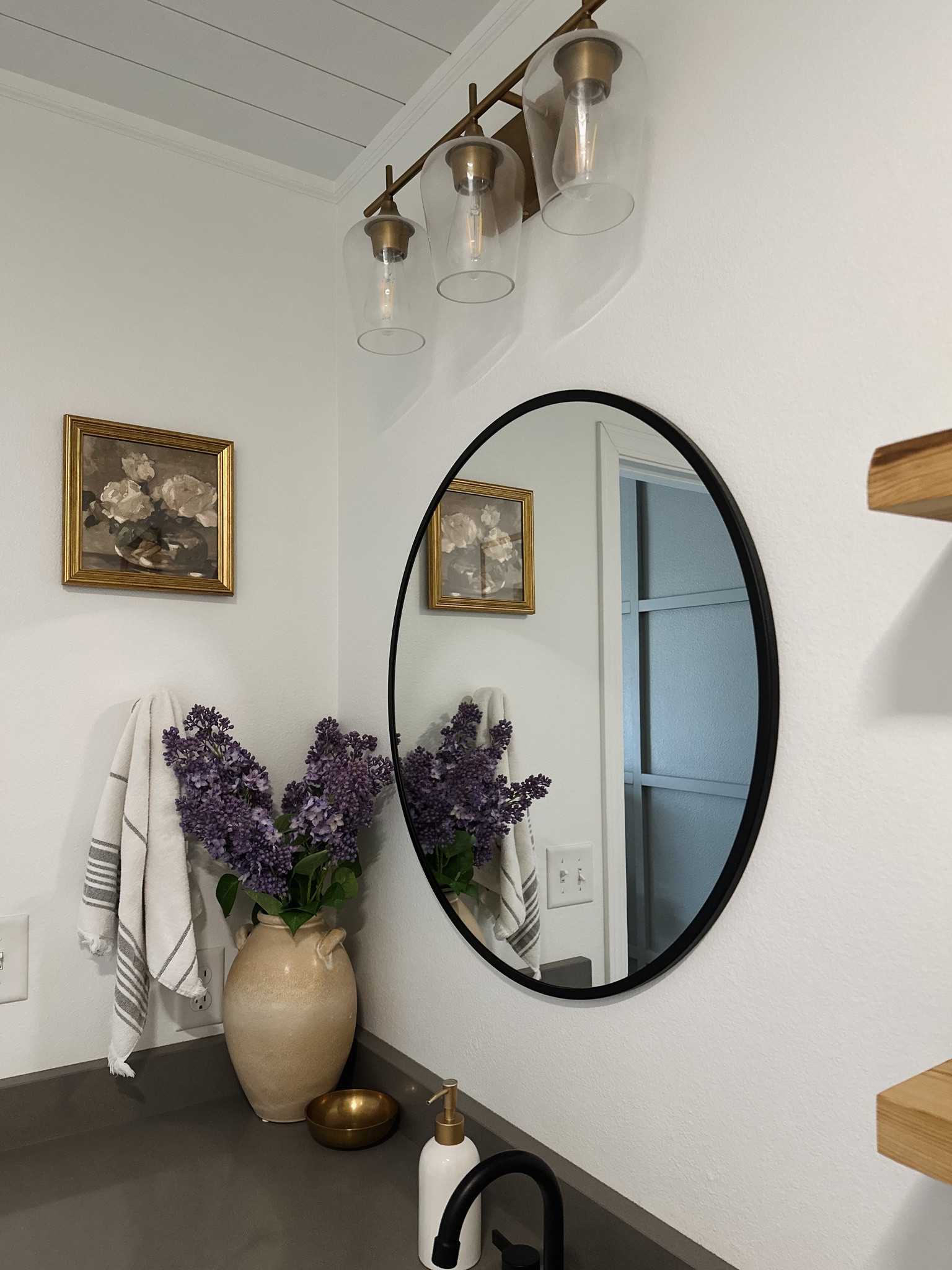 Brass vanity light, terracotta vase, faux afloral lilacs, brass frame, round black mirror, hearth and hand hand towel, matte black faucet, grey quartz countertops, wayfair find, Amazon find, target find, studio McGee, home decor. 

#LTKhome #LTKFind #LTKstyletip