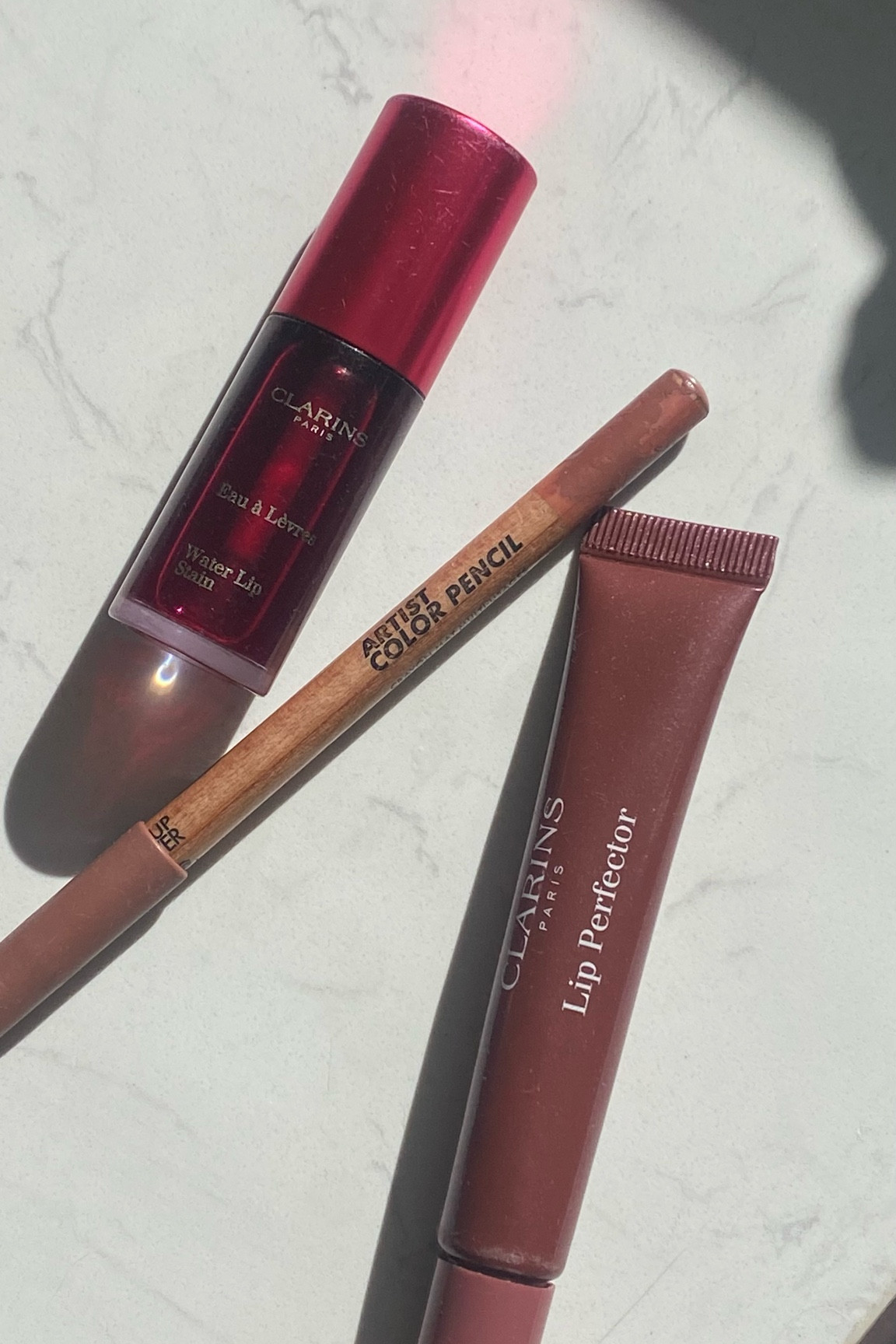 my go to lip color combo ~ clarins water lip stain in violet, lip perfect or in mulberry, makeup forever lip liner in anywhere caffeine 

#LTKBeauty #LTKItBag #LTKGiftGuide