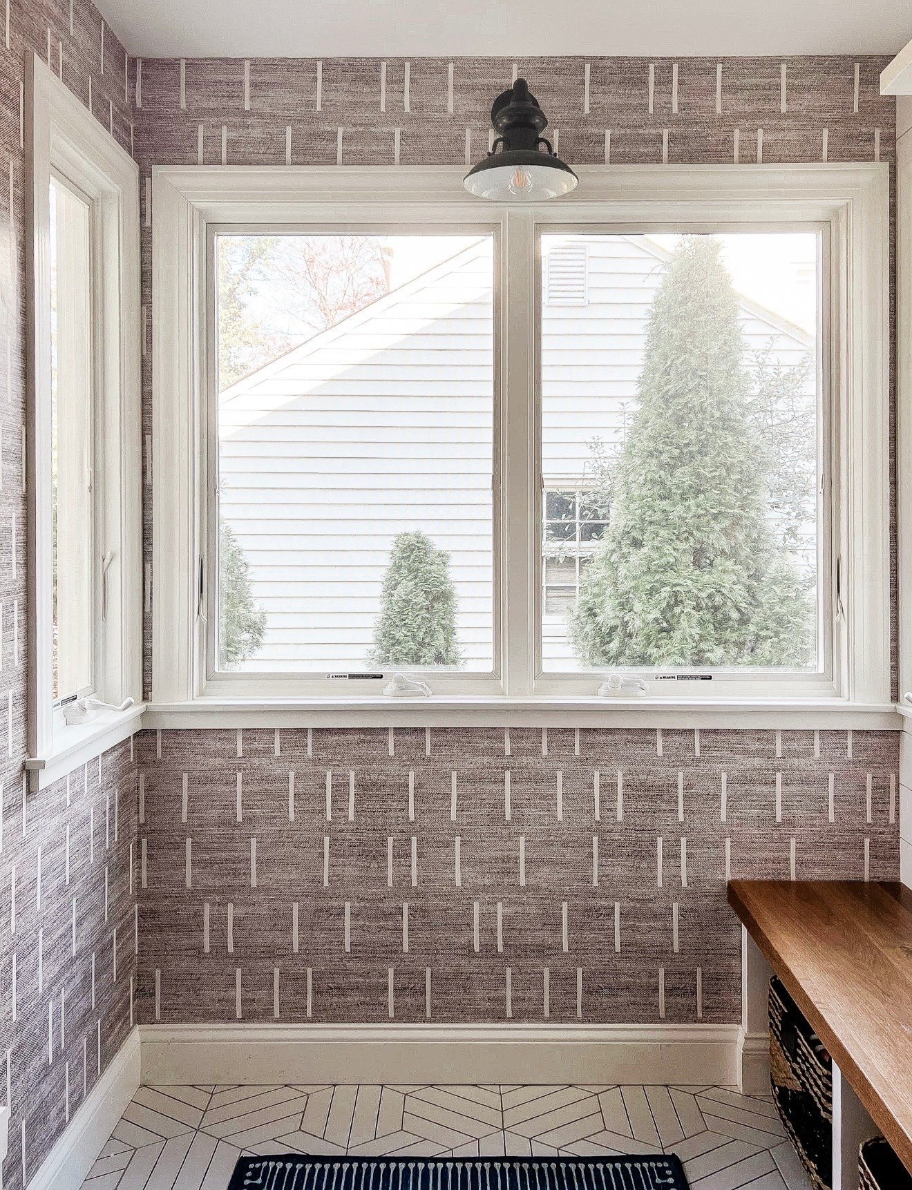 A little pattern can go a long way in a small space. The geometric wallpaper, patterned tile and blue rug all have different scales, but the restrained palette keeps everything working together.

pattern mixing, geometric wallpaper, patterned tile, blue rug, small space decor, mudroom inspiration, wallpaper ideas, layered patterns, interior styling, Girl on the Hudson

#LTKHome