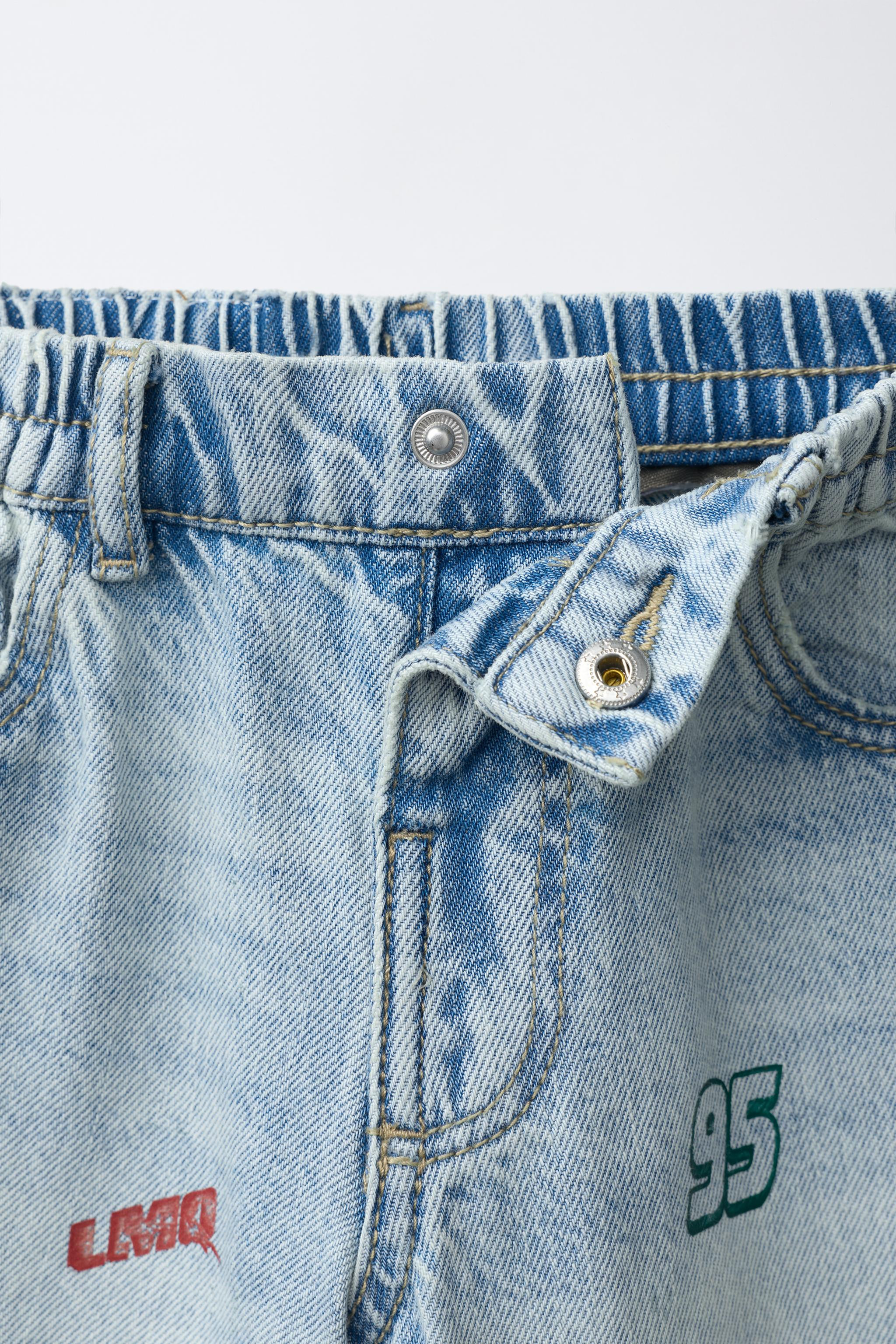 Baggy jeans with an elastic waistband and front snap-button closure. Features front pockets and p... | Zara US