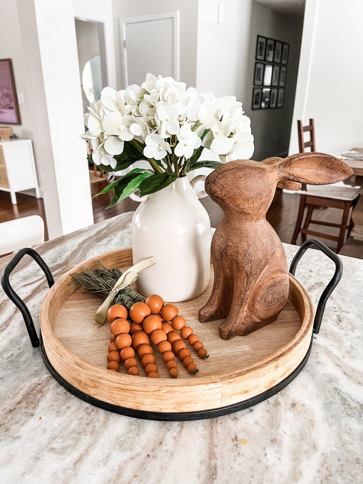 Spring tray styling idea! I’m really in love with this combo. The rabbit and carrots are by The Farmhouse by Rachel Ashwell, found them at TJMaxx. The hydrangea stems are also TJMaxx; linked similar. Vase and tray are Walmart. #easter spring decor kitchen island centerpiece idea modern farmhouse Nancy Meyers New England aesthetic neutral decorations