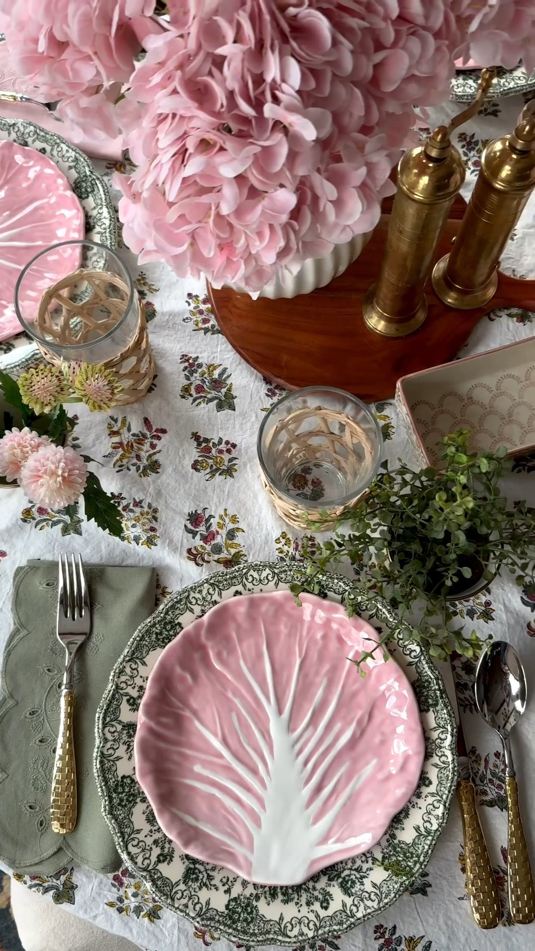 It was a dreary day outside so I created some colorful cheer on the inside. This was such a fun spring/Easter tablescape to put together. I’m linking everything I can for you guys including the floral block print tablecloth, scallop eyelet napkins, pink cabbage salad plates, pink check small pots, artificial real touch hydrangeas, custom buffalo print curtains, crystal chandelier, pleated chandelier shades, brass salt and pepper mill, and more. 

#LTKSpringSale #LTKSeasonal #LTKHome