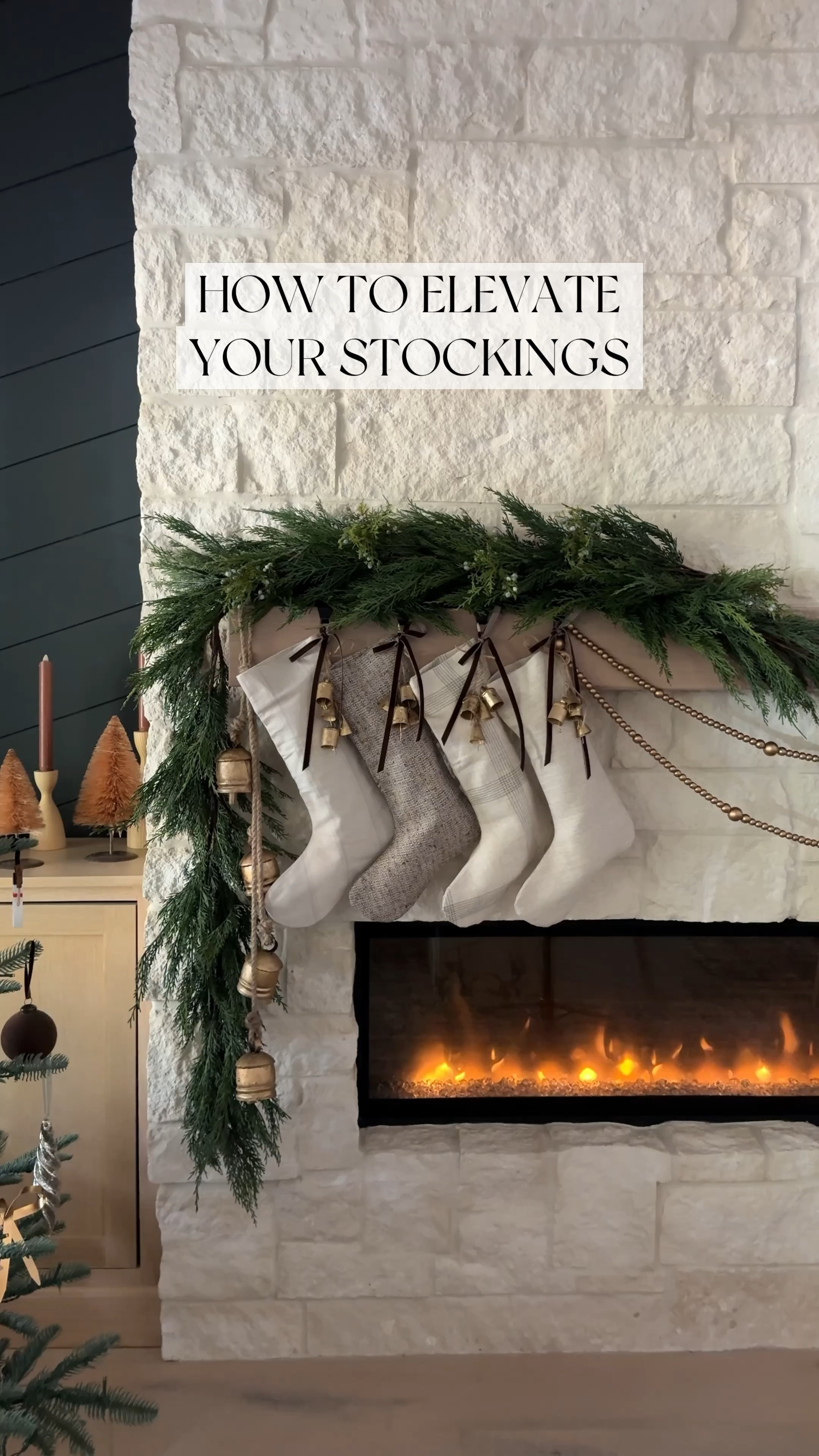 How to  elevate your stockings. Love these vintage bells and the ribbon. They add so much more interest to our mantle.

Christmas decorations, Christmas wood bead garland ornaments, Amazon, king of Christmas, Wayfair, icicle, ornaments, round ball, ornaments, stocking, stocking mantle holder, fireplace, design, Juniper berries, garland  Norfolk chandelier, white swivel chair, vintage rug command hooks chord bow Wayfair etsy Twinkie tree bells brown ribbon Christmas decor 

#LTKHome #LTKSaleAlert #LTKFindsUnder100