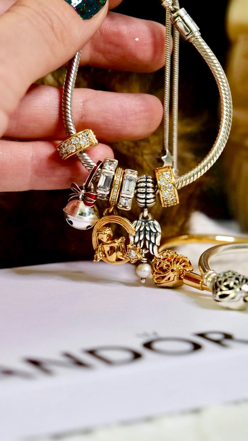 Let’s design a Pandoracharm bracelet inspired by the film, It’s A Wonderful Life ✨ For this styling, I wanted to incorporate the new Holiday Bell Dangle Pandora Charm. For my Pandora bracelet, I used the Pandora Moments Pavé Star & Snake Chain Sliding Bracelet. The star-shaped clasp immediately reminded me of the film’s angels, represented as stars in the night sky. To complement the theme, I added a retired angel and moon charm and a retired guardian angel charm (it features a real freshwater pearl). 🪽✨

It’s a comforting thought—that when we hear bells chime or see stars shining brightly, they might be signs that our loved ones who have passed are watching over us. 🔔⭐️✨

How would you style this Pandora charm? I think it would also new beautiful styled with a Polar Express theme. I don’t have the Pandora Christmas Train charm or the Disneyland Disney Parks Railway Pandora Charm, but I think both of those would work beautifully! Ooh, and the Hogwarts train Pandora charm too!!! 🚂✨

Check out the @theartofpandora blog for more holiday styling ideas! 🎄⭐️✨

Pandora charm bracelets, Pandora bracelet, Pandora charms, Pandora jewellery, Christmas jewellery, holiday jewelry, holiday styling, every time a bell rings an angel gets its wings 🪽 #theartofpandora #theofficialpandora #pandoracharms #charmbracelet #pandorajewellery

#LTKholiday #LTKpartywear #LTKcanada