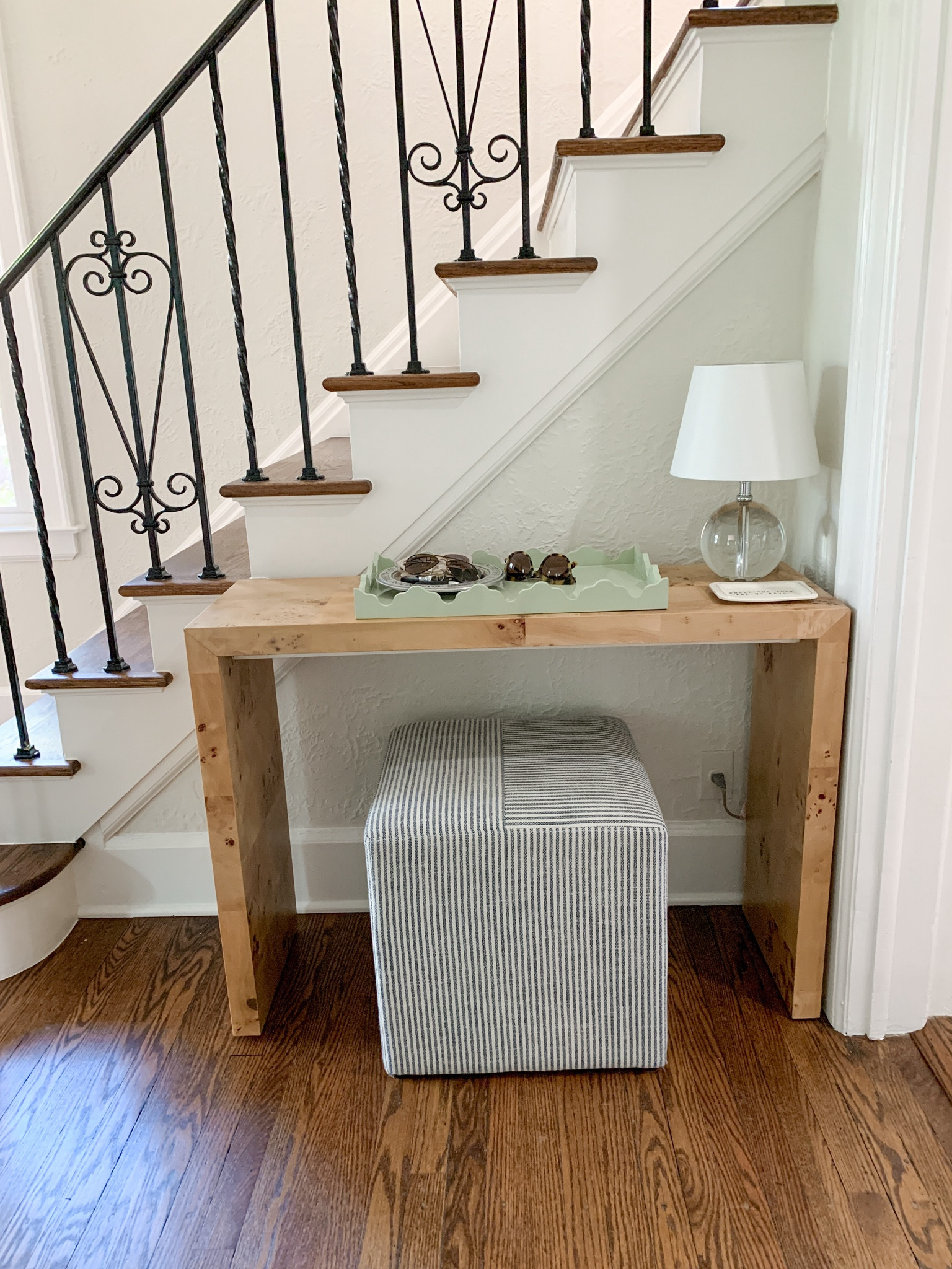 Updated entryway with Burl wood table and a very affordable upholstered cube for extra storage 

#LTKHome #LTKFindsUnder100
