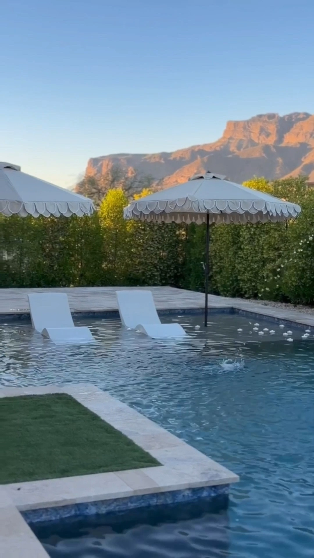 This has been my favorite spot lately 🤍

These designer inspired outdoor finds came together so beautifully. Chaise lounges, fluted chairs, sculptural umbrellas, and concrete side tables… it just feels calm and elevated.
Loving the UV faux bushes and florals in the oversized pots 🌿 the easiest maintenance ever and look real! 

outdoor patio furniture 
designer inspired outdoor
modern patio furniture
faux outdoor plants
resort style patio 

#summerthompsonstyles

#LTKSeasonal #LTKdayinmylife #LTKHome