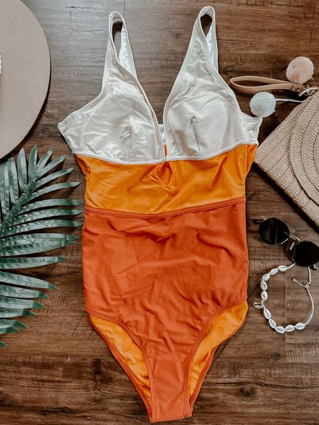 Amazon orange color block one piece bathing suit! Boho color block one piece swim suit. Has key hole cut out. More mid coverage cheeky bottom. Sized up - chest runs small! 

#LTKtravel #LTKswim #LTKSeasonal