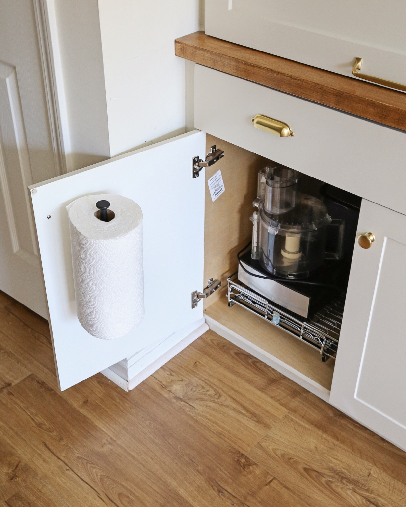 Wall mounted paper towel holder, under cabinet organization, sliding pullout cabinet drawer

#LTKHome