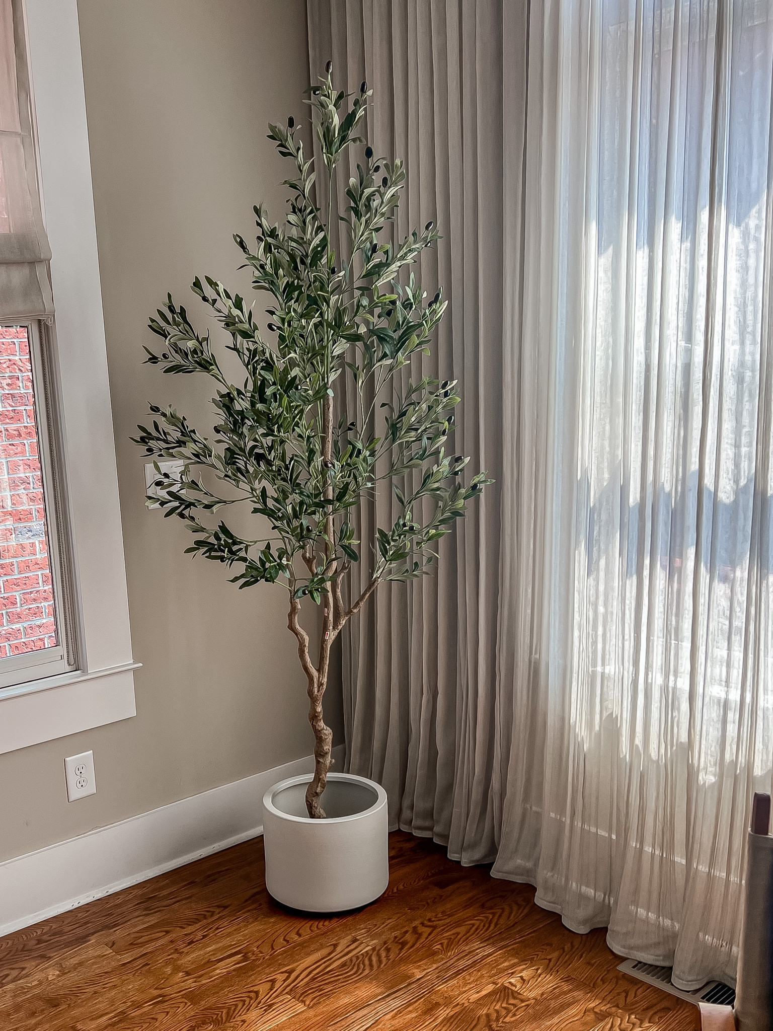 Affordable olive tree from Amazon. It’s as good or better as the expensive ones from pottery barn or crate and barrel at a fraction of the cost. Comes in multiple sizes - we have the 7ft.  

Olive tree
Artificial tree 
Faux olive tree 
Artificial olive tree 
Fake olive tree 
Fake tree for inside 
Artificial tree for inside 
Artificial house plant 
Affordable olive tree 
Amazon olive tree 
Amazon finds 
7ft olive tree 
6ft olive tree 
10ft olive tree 
Transitional design 
Transitional decor 

#LTKunder100 #LTKhome #LTKstyletip
