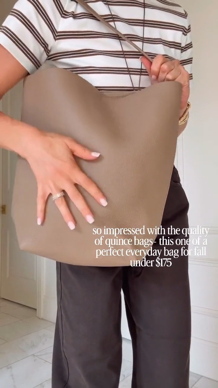 Got barrel jeans in from @Target under $45 love the chocolate brown color they fit so well I'm wearing size 2/25 and I'm 57 for reference wearing size small and love this quince bucket tote.