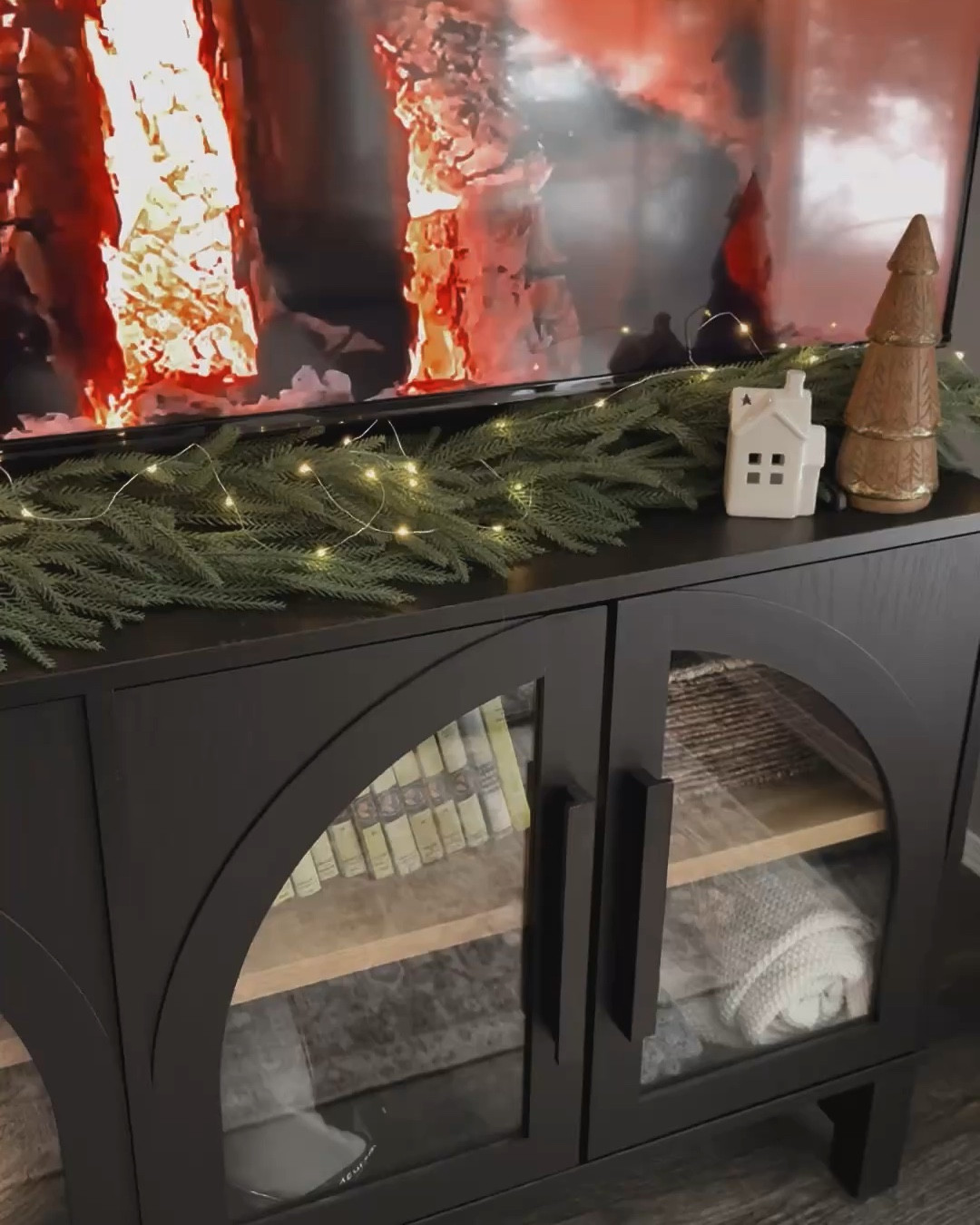 Added another garland for a fuller look and I love it way more! Now I’m very aware my tv is way too big for this console but someone just HAD to have a bigger tv and now refuses to do the work to get it on the wall. 🤪🙄 send help.

#LTKholiday #LTKcanada #LTKhome