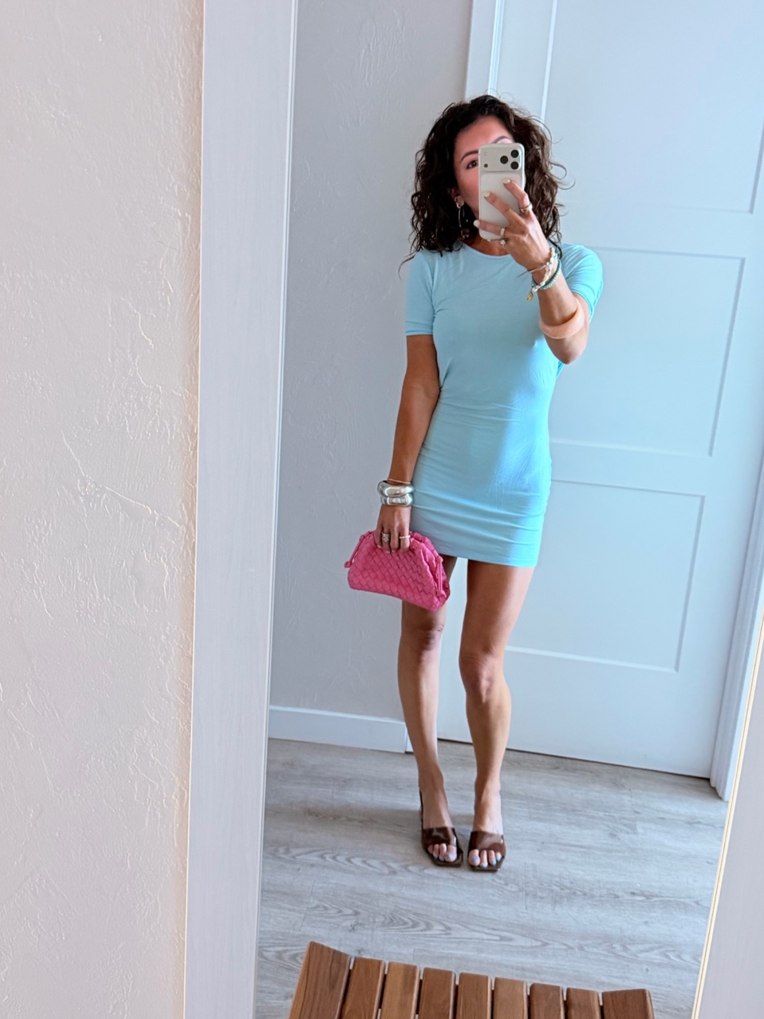A tshirt dress but with so much style! She’s got a draped back detail. She’s pretty thin but I have seamless undergarments on. I think this dress would be so cute with hair up in a big, thick high pony tail. Pop of pink with the bag and tons of bangles. Easy, simple, perfection. Wearing XS prob would have sized up to a Small.

#LTKgrwm #LTKMidsize #LTKSeasonal