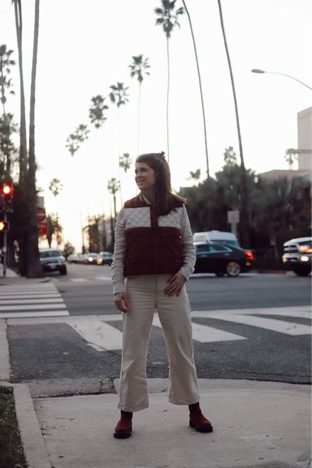 Cream crop wide leg pants, rust vest, waterproof boots 