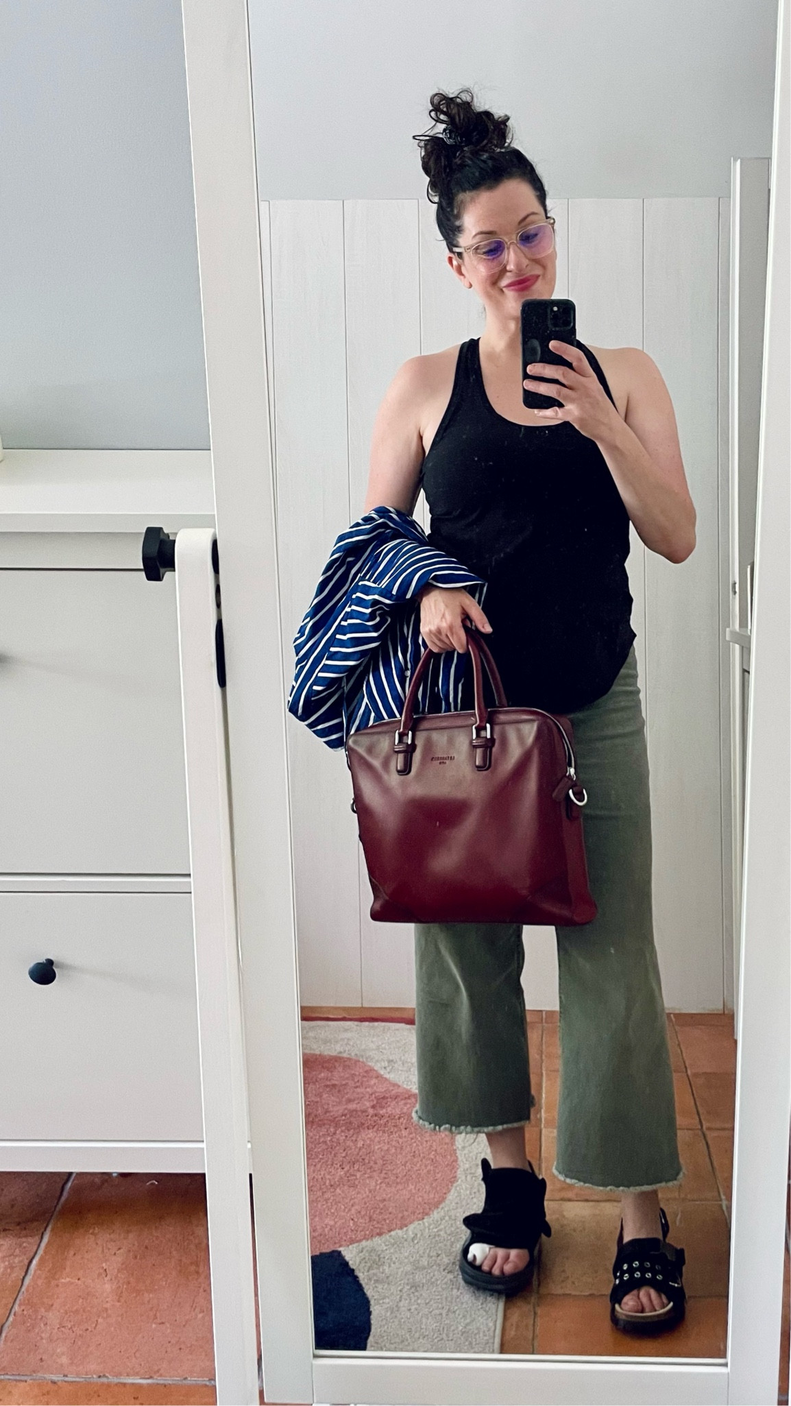 . Black tank top #crzyoga (linked)
. Striped blue shirt #arket (similar, linked)
. Burgundy leather briefcase #letanneur 
. Barrel jeans #kiabi (similar, linked)
. Eyelet black sandals #apc x #sacai 
. Translucet frame glasses #calvinklein


#LTKsummer #LTKmidsize #LTKfrance