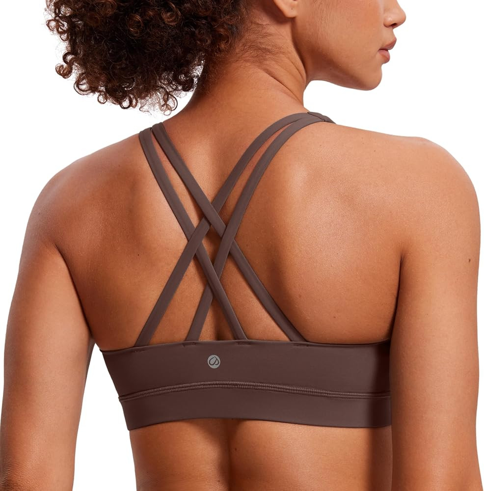 CRZ YOGA Women's Strappy Sports Bras Fitness Workout Padded Yoga Top Criss Cross Back Cami | Amazon (US)