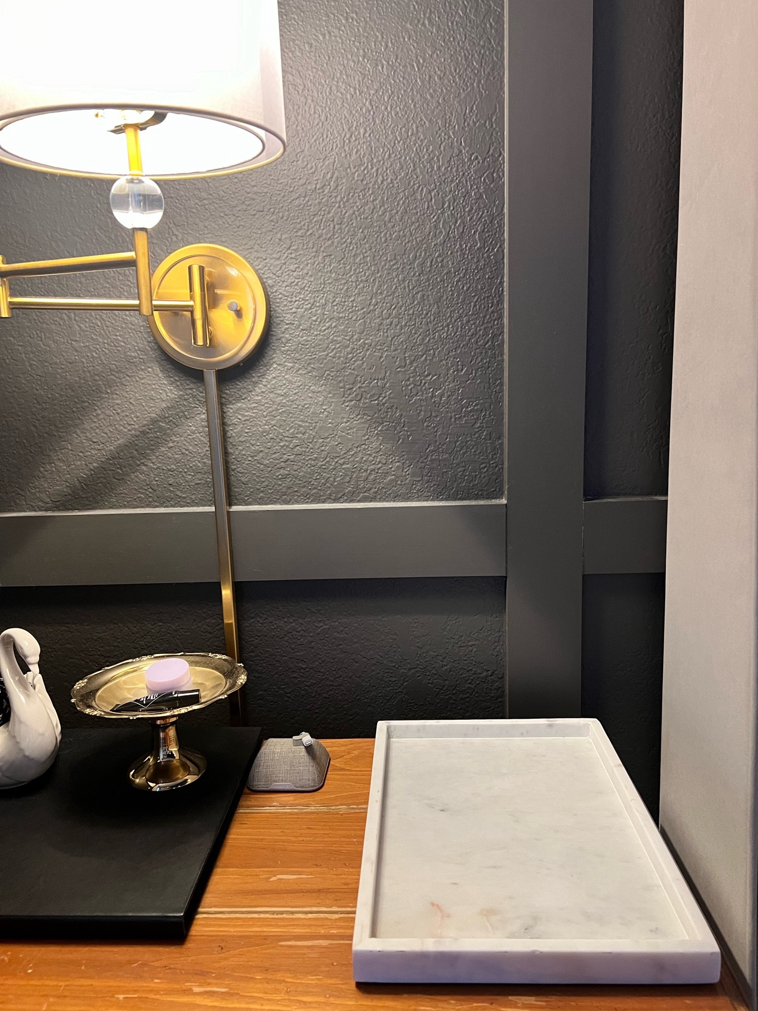 Using this white marble tray to hide the damage in my husband’s side table. Looks chic and hides damaged wood!

#LTKhome #LTKfindsunder50 #LTKstyletip