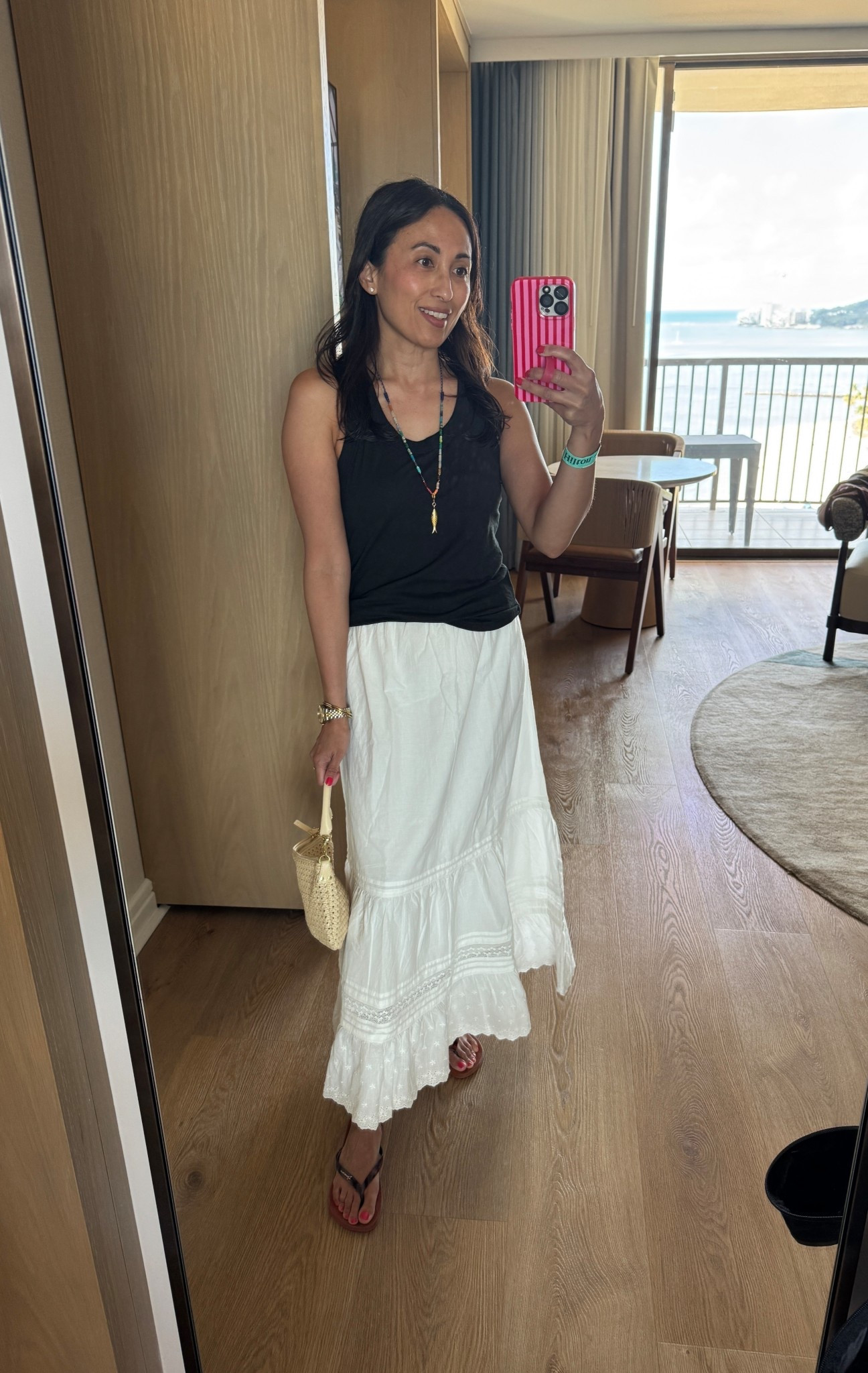 Vacation outfit. Spring break. 
White skirt is all cotton with embroidered details. Elastic waist with drawstring. Lined. True to size. 
Black cotton tank top. True to size. 
Woven handbag. 
Comfy flip flops. True to size. 


#LTKOver40 #LTKTravel