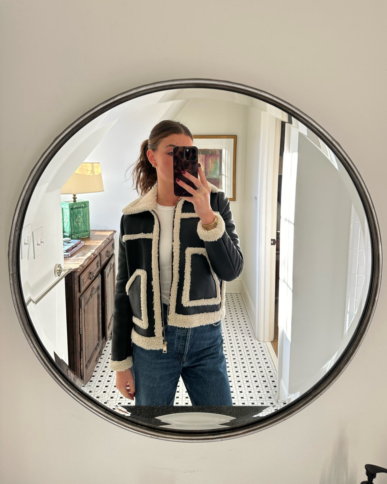 Black and white sherpa jacket and leather jacket. Dark wash jeans. White long sleeve tee. Cold weather outfit. Travel outfit. Work outfit. Gold jewelry. Holiday outfitt

#LTKWorkwear #LTKSeasonal #LTKHoliday