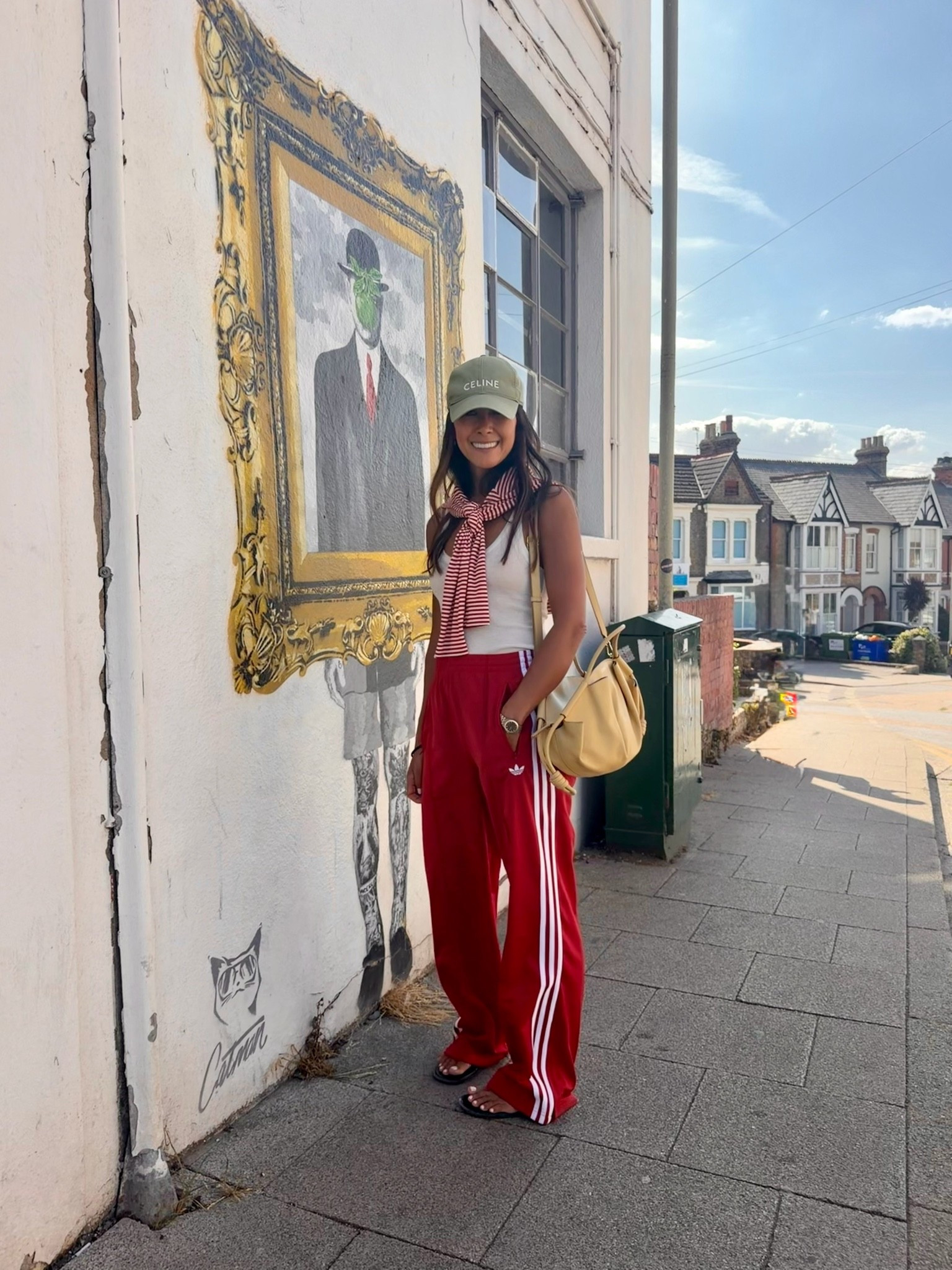 Another Off duty weekend mum look. 
Wearing Adidas Firebird pants in Small. I’m 5.5 for reference.
Celine cap (old)
Zara vest size small.
Red strip cotton long sleeve top size medium. 
Pre loved Loewe Paseo bag. 
H&M red sandals

#LTKFashionMonth #LTKuk #LTKsummer