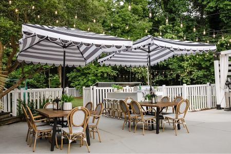 Best outdoor dining table & chairs! We get a ton of compliments. You can find the umbrella on Wayfair or Amazon. 

Bistro chair, Serena and lily dupe, outdoor chair, rattan, stripe umbrella, outdoor party, hosting

#LTKSeasonal #LTKhome
