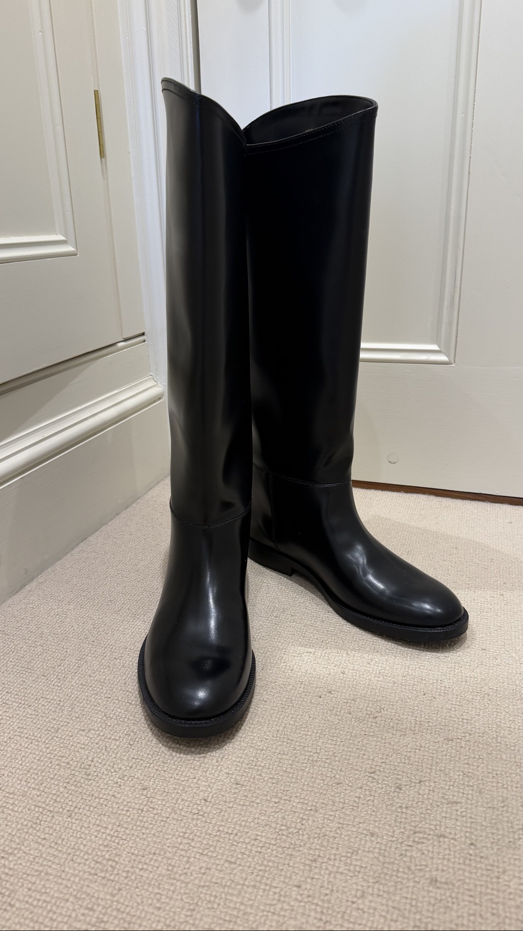Black knee length riding boots 
£64.99
True to size