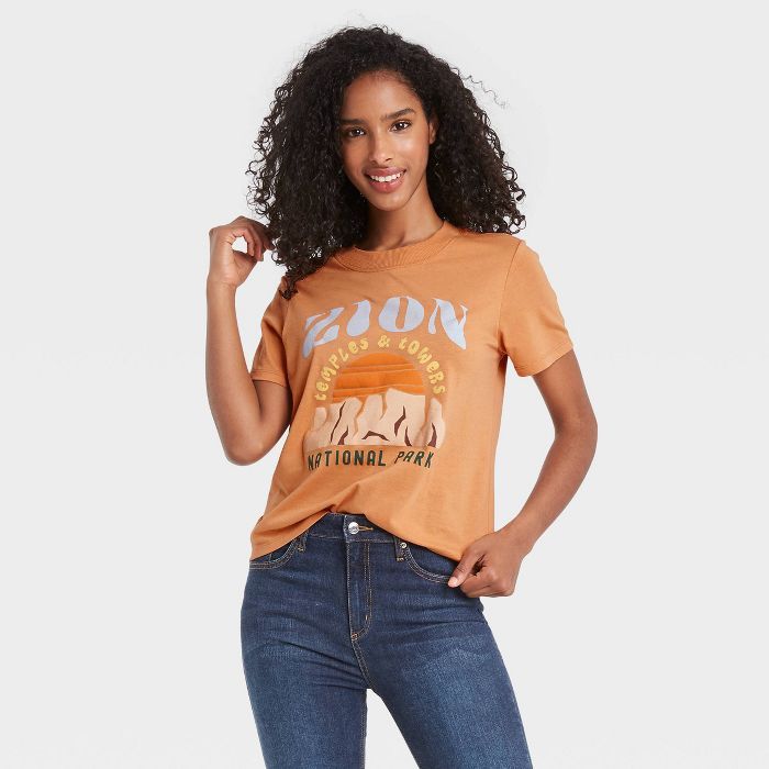 Women&#39;s Zion Shrunken Short Sleeve Graphic Boxy T-Shirt - Camel M | Target