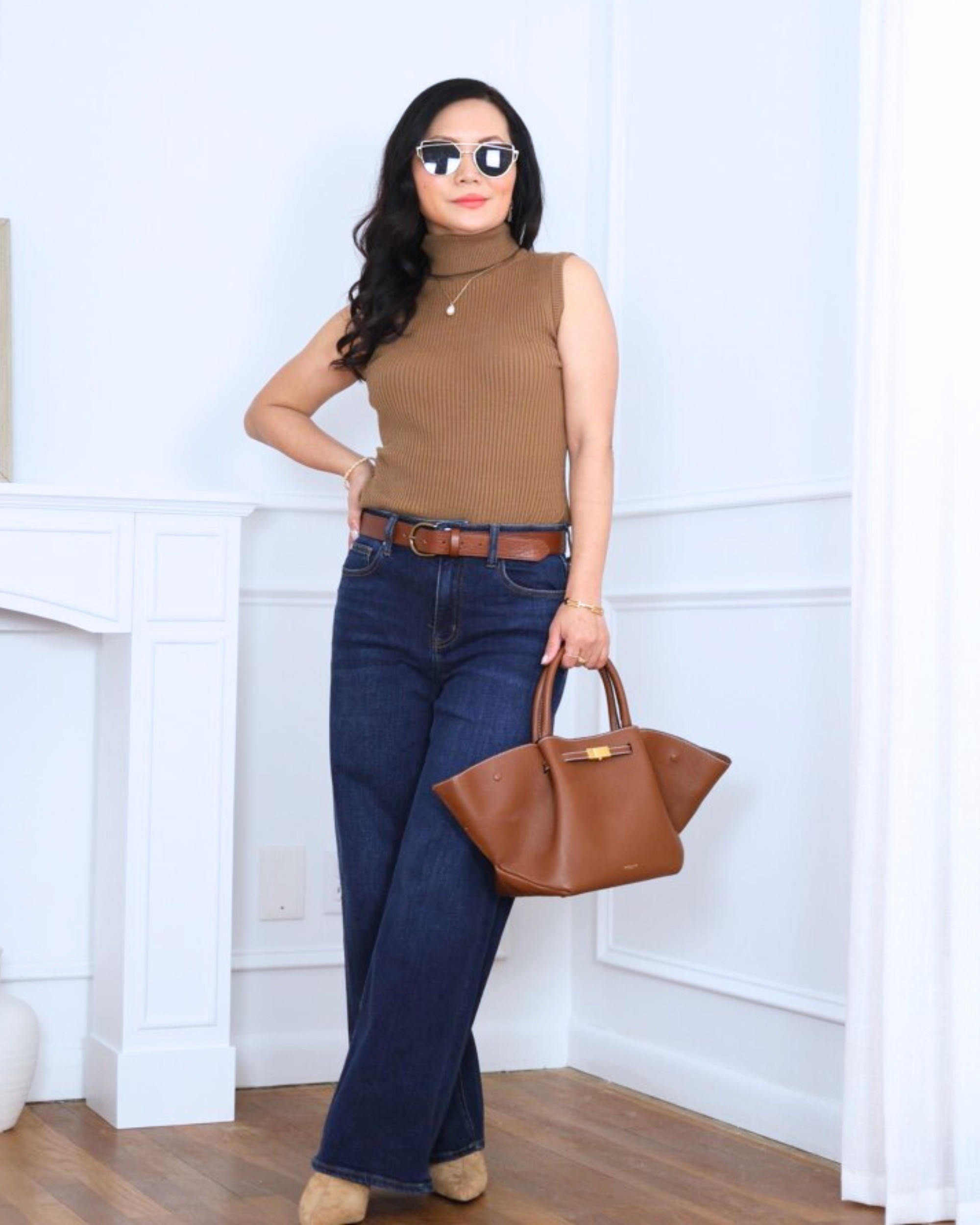 Simple and sleek — a sleeveless turtleneck top from Amazon paired with wide-leg jeans from Abercrombie for an easy, modern look that feels polished without trying too hard. I’m 5’2, wearing size XS.

#LTKOver40 #LTKootd #LTKPetite