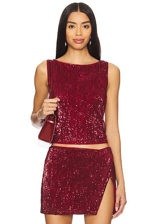 Sequin outfits for Winter Holiday Party Season. Emerald sequin dress. Red sequin dress. Green sequin top. Green skirt. Red sequin top. Red blazer. Red pants. Sequin blazer outfit. | Revolve Clothing (Global)