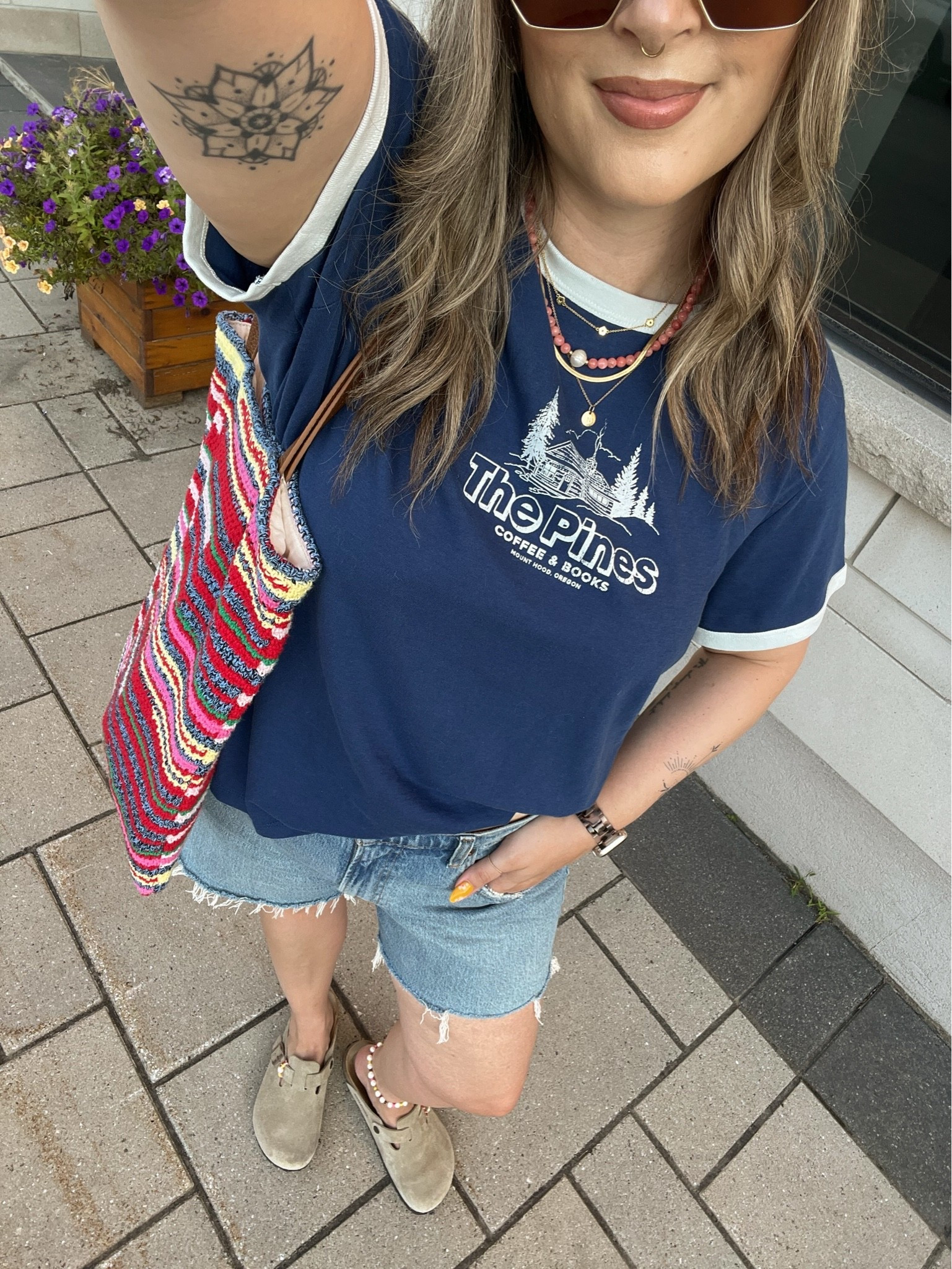 Casual summer outfit!! Sized up to XL in the graphic for an oversized fit. Canadian tee & tote bag links under “similar products”. Also sized up to 32 in the denim shorts for a loose fit. Birkenstock clogs are super comfy, I’m a 9.5-10 shoe and wear a 40.

#LTKsale #LTKsummer #LTKmidsize
