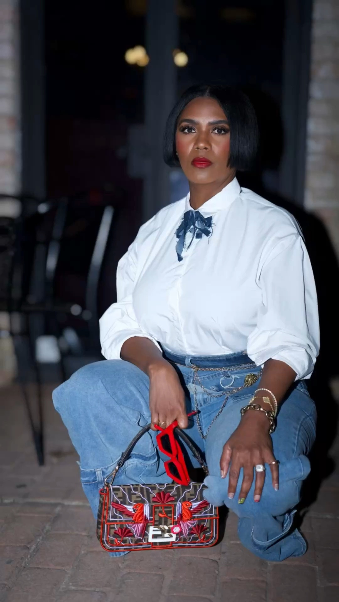 Hey Nieces 💋✨

Let’s get into this look because she’s giving clean, classic, and intentional 👏🏽

Crisp white button-down (a forever staple), paired with my Fashion Nova wide-leg denim—because a good jean will NEVER fail you. Now let’s talk details… I added a denim bow that I created 🎀 (yes ma’am, DIY’d  it) and matched it with my custom denim belt… isn’t she cute?! 😍

Finished her off with red sunnies, my abstract Fendi baguette, and those red mesh kitten heels from Amazon—because a pop of red will elevate EVERY. SINGLE. TIME. ❤️

Nieces, don’t sleep on what’s already in your closet. Mix, match, and create the aesthetic YOU want. Style is not about having more—it’s about doing more with what you have.

You already know… I’m keeping it clean, classic, and timeless. Always. ✨

Styled: Auntie Tina💋❤️
📸: @shotbylae 

#AuntieTinaStyle
#FashionOver50
#ClassicStyle
#DenimOnDenim
#StyleWithIntent
