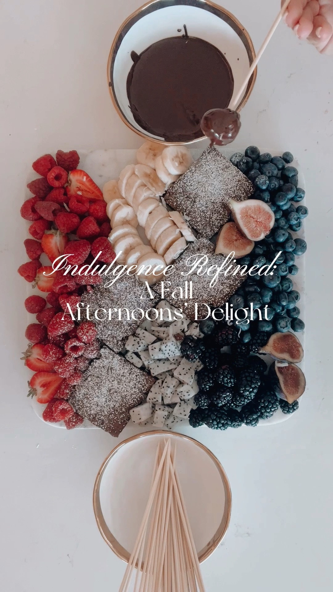 Imagine a glamorous snack board, perfect for a cozy Fall afternoon. Outside, raindrops create a soothing melody on your windows, and a crackling fireplace bathes the room in a warm, golden glow. You're lounging on a luxurious couch, a cup of tea in hand, and the world seems to slow down.
Now, your eyes are drawn to the exquisite spread. Fresh fruits glisten, beckoning with their natural allure. Brownies, delicately dusted with powdered sugar, hint at decadence. At the heart of it all, a velvety chocolate fondue invites you, like a star ready to take the stage.
This is more than a snack—it's a moment of relaxed glamour. With each sip of tea and every delectable bite, you're embraced by an ambiance of effortless indulgence. Life's true richness lies in these small, beautiful moments—a tapestry woven with everyday luxuries and laid-back elegance. Stay sparkling; let the glamour shine! ✨ 

#LTKhome #LTKSeasonal