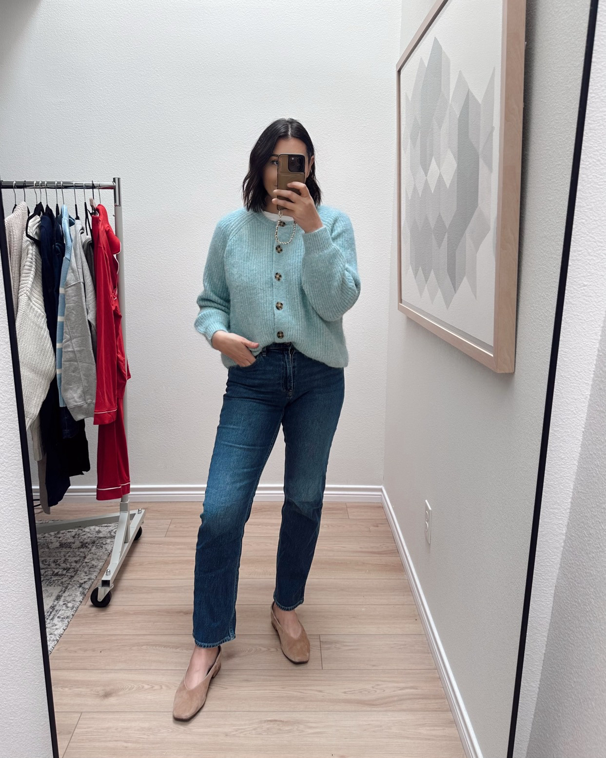 I'm in the medium of both sweaters -- fit is relaxed! Size down if in between sizes. 

I'm in the 30 of the jeans. They fit tight at first, but stretch with wear.  

 