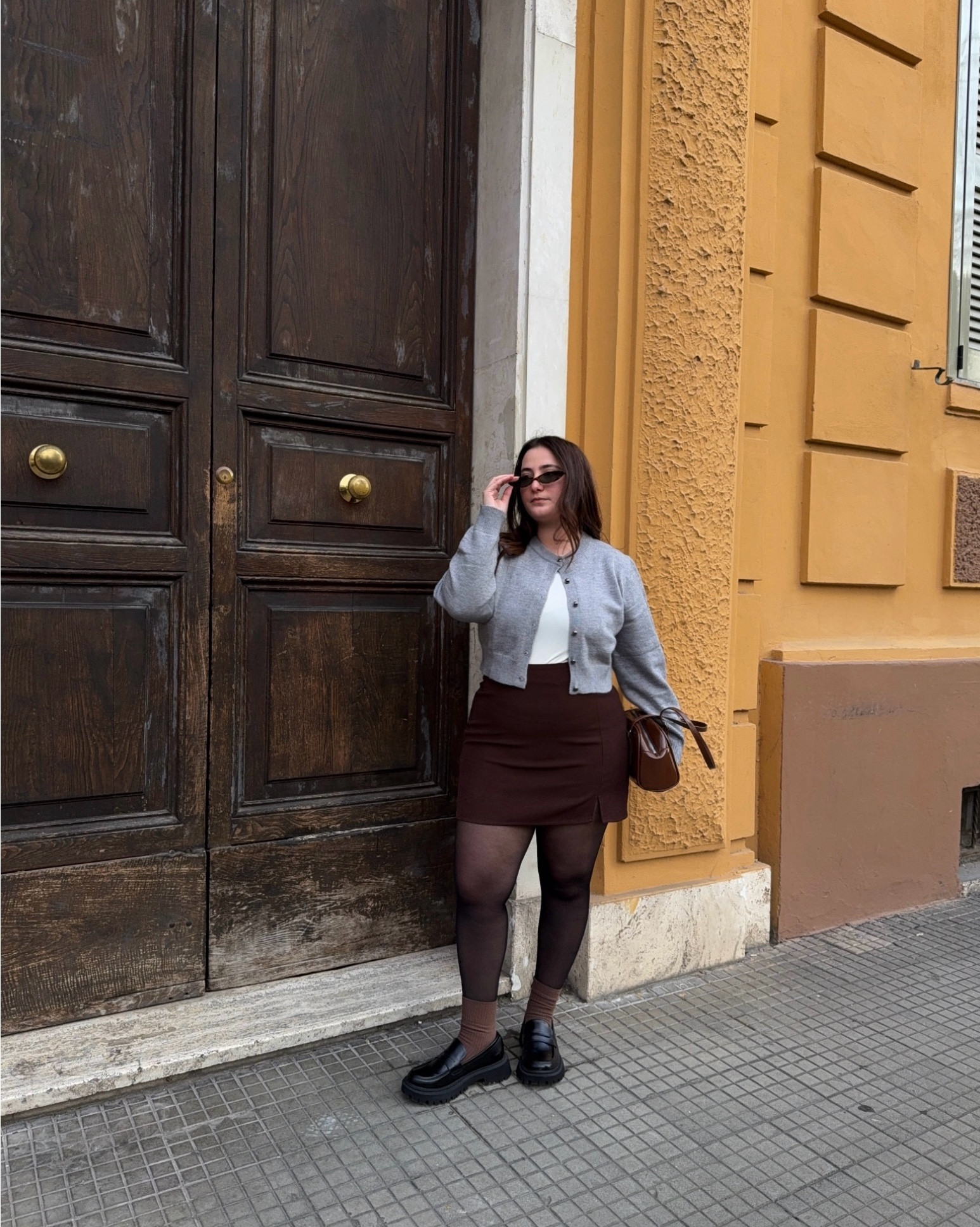 Spring outfit for midsize girls wearing a brown mini skirt, grey cardigan e black loafers 

#LTKeurope #LTKspring #LTKmidsize